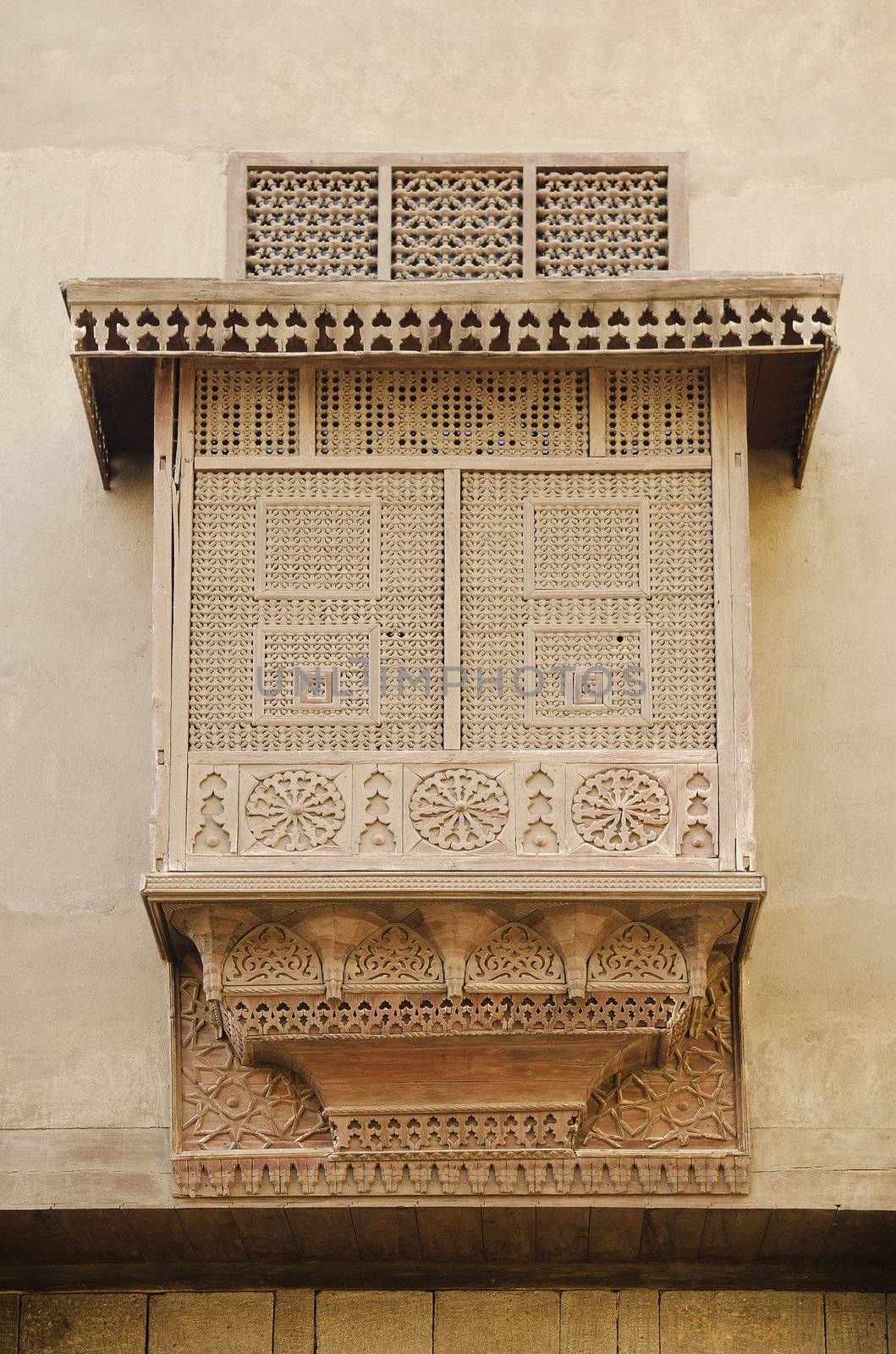 traditional carved wood window in cairo egypt by jackmalipan