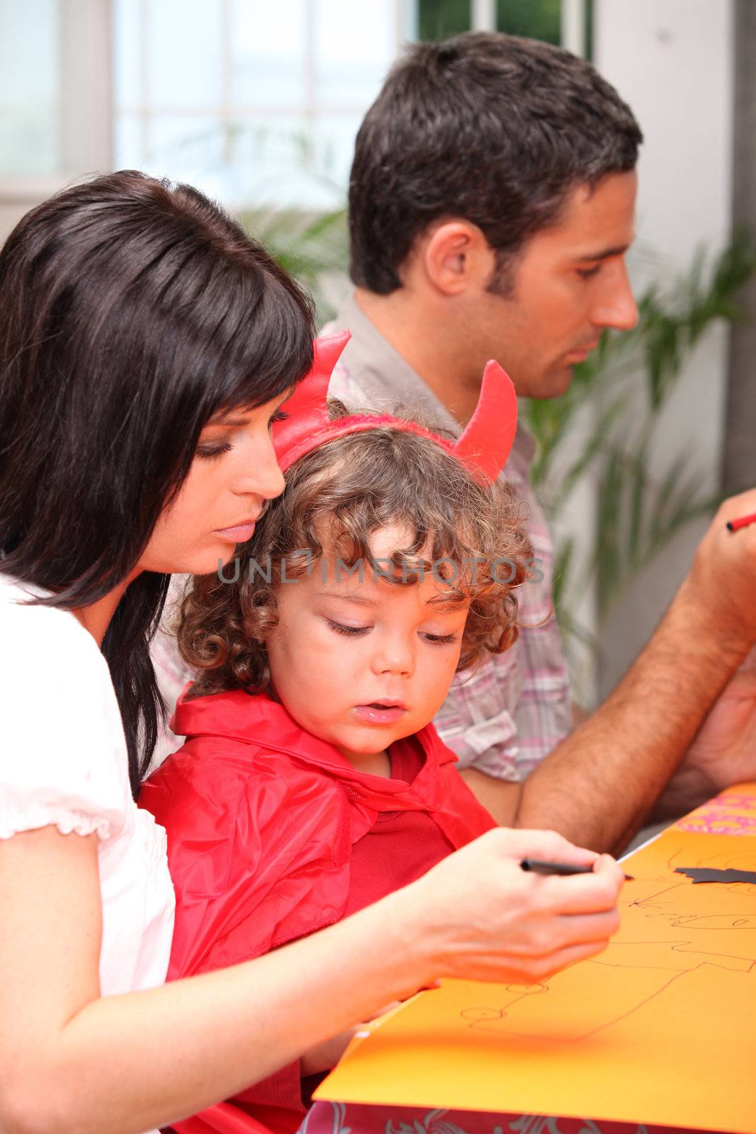 family preparing fancy-dress ball