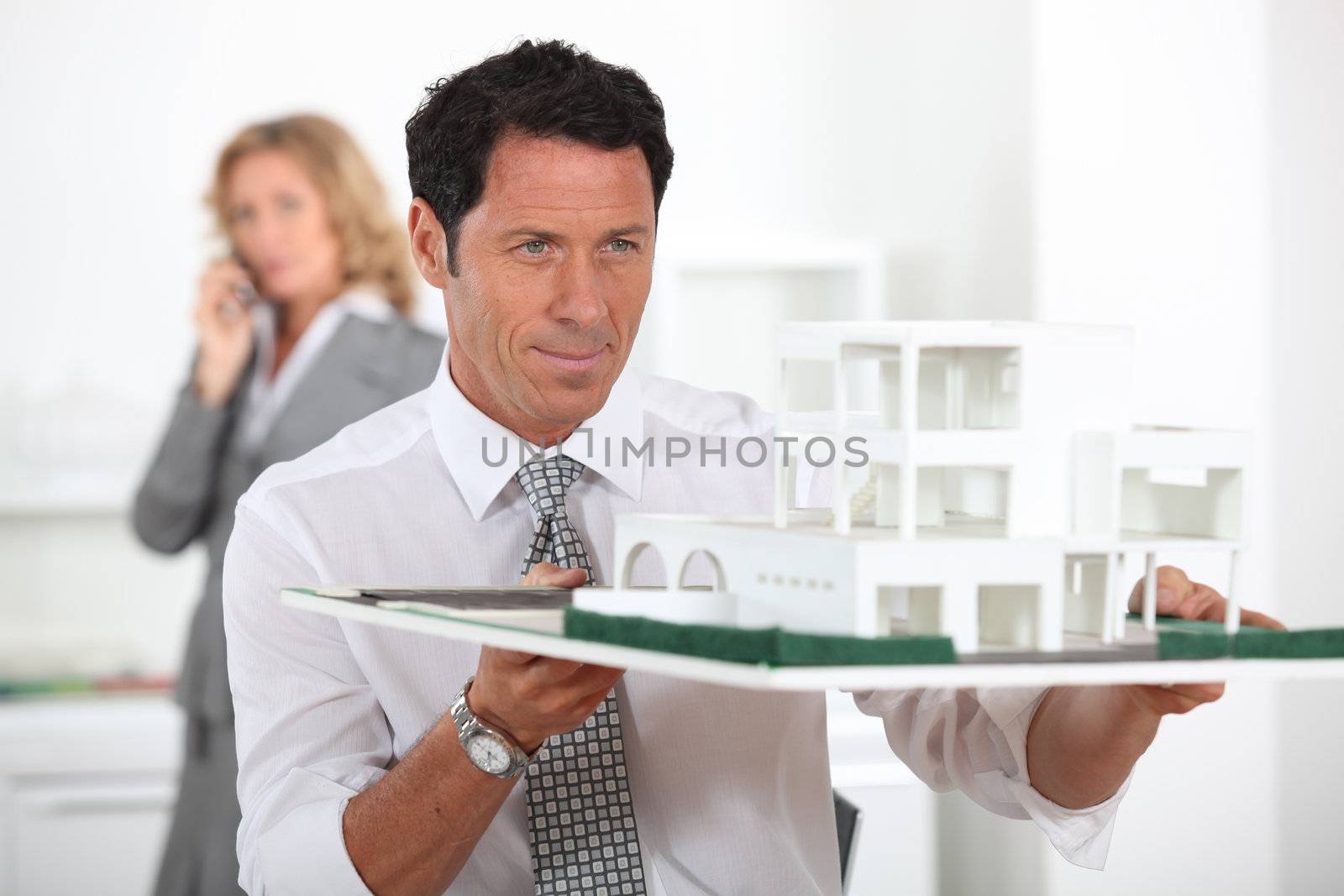 Architect with a model development by phovoir