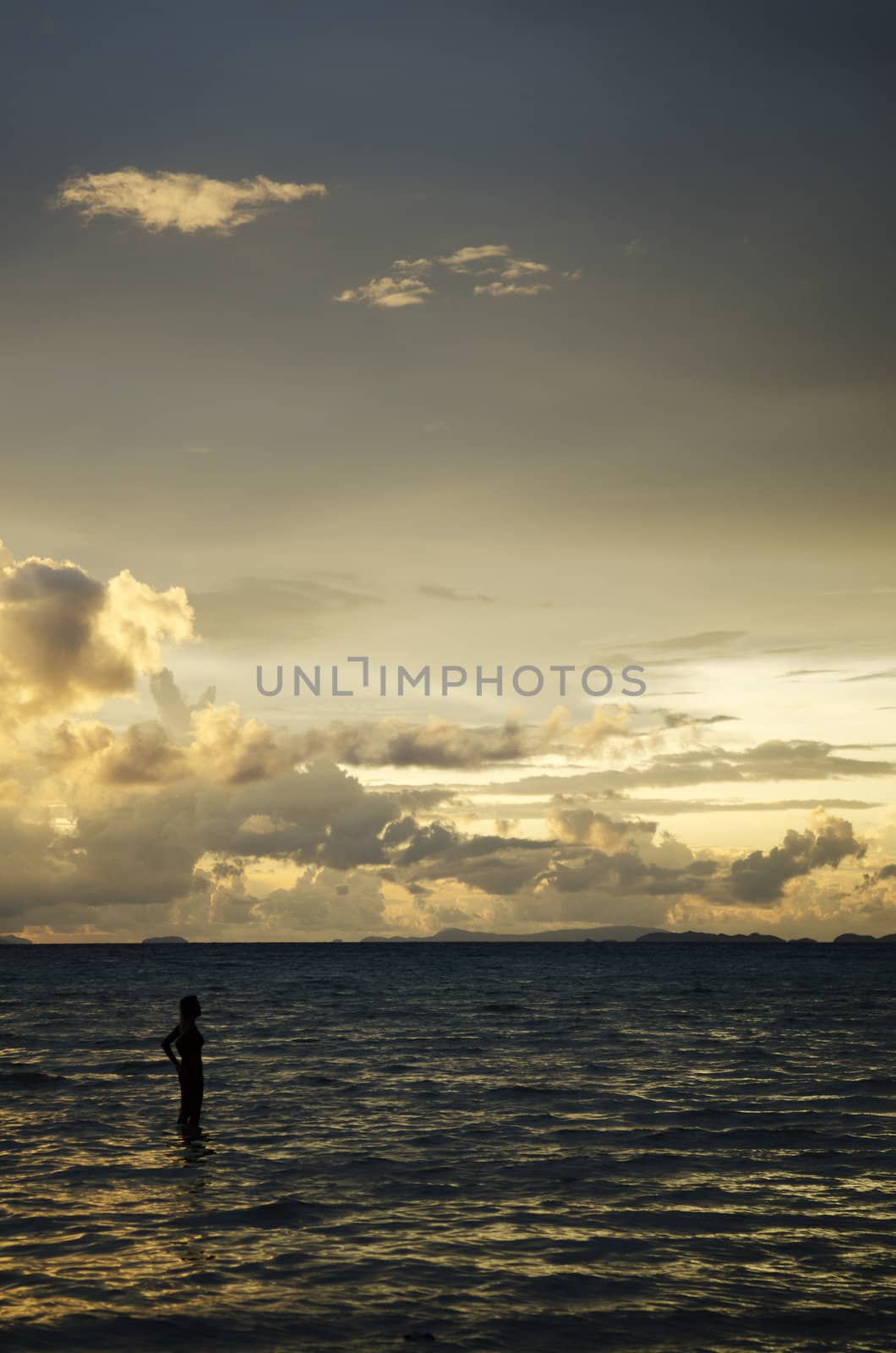 tropical sunset with tourist woman