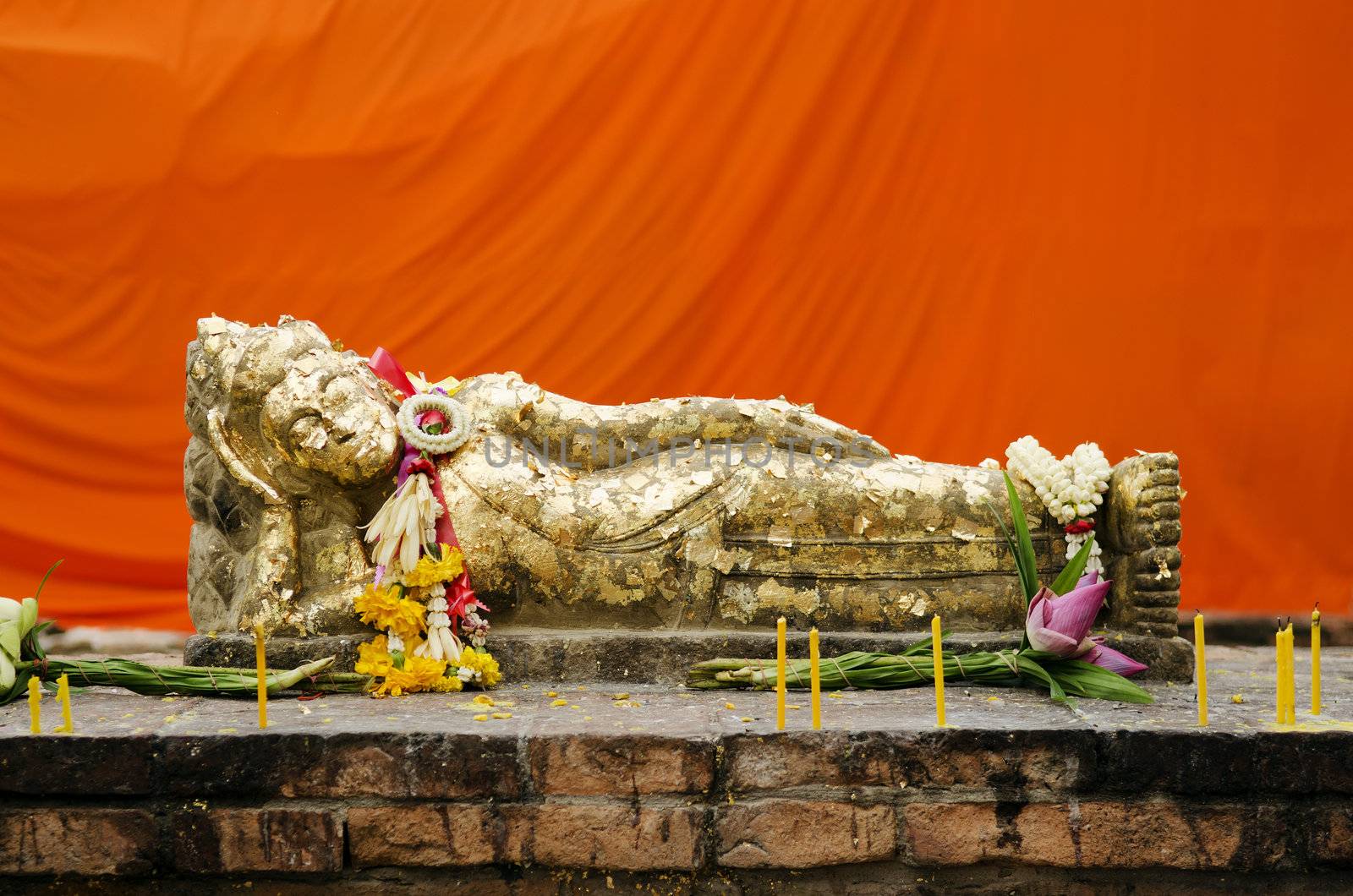 reclining buddha statue with gold leaf in thailand