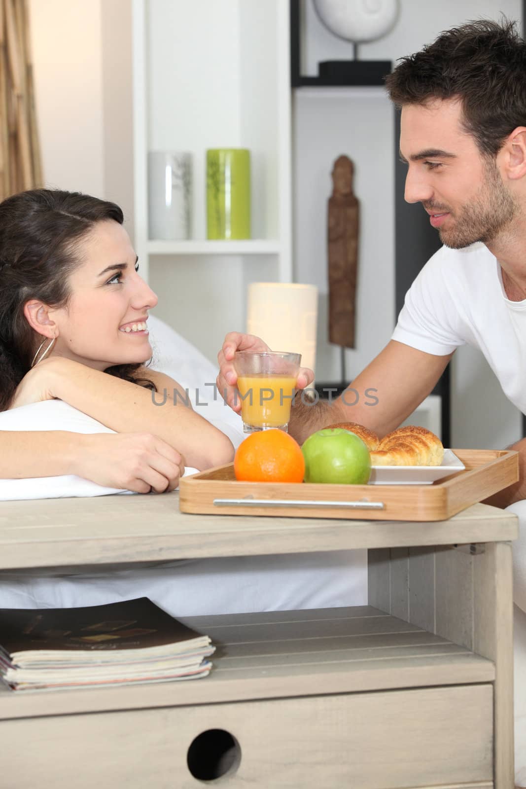 Couple enjoying romantic meal by phovoir