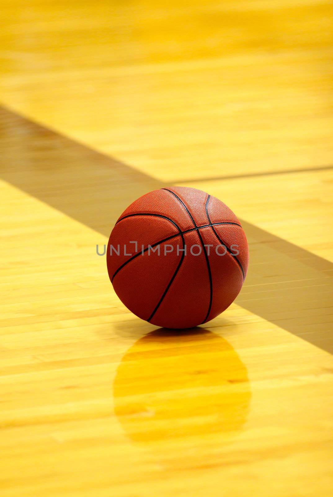 orange basket ball on yellow court at break time