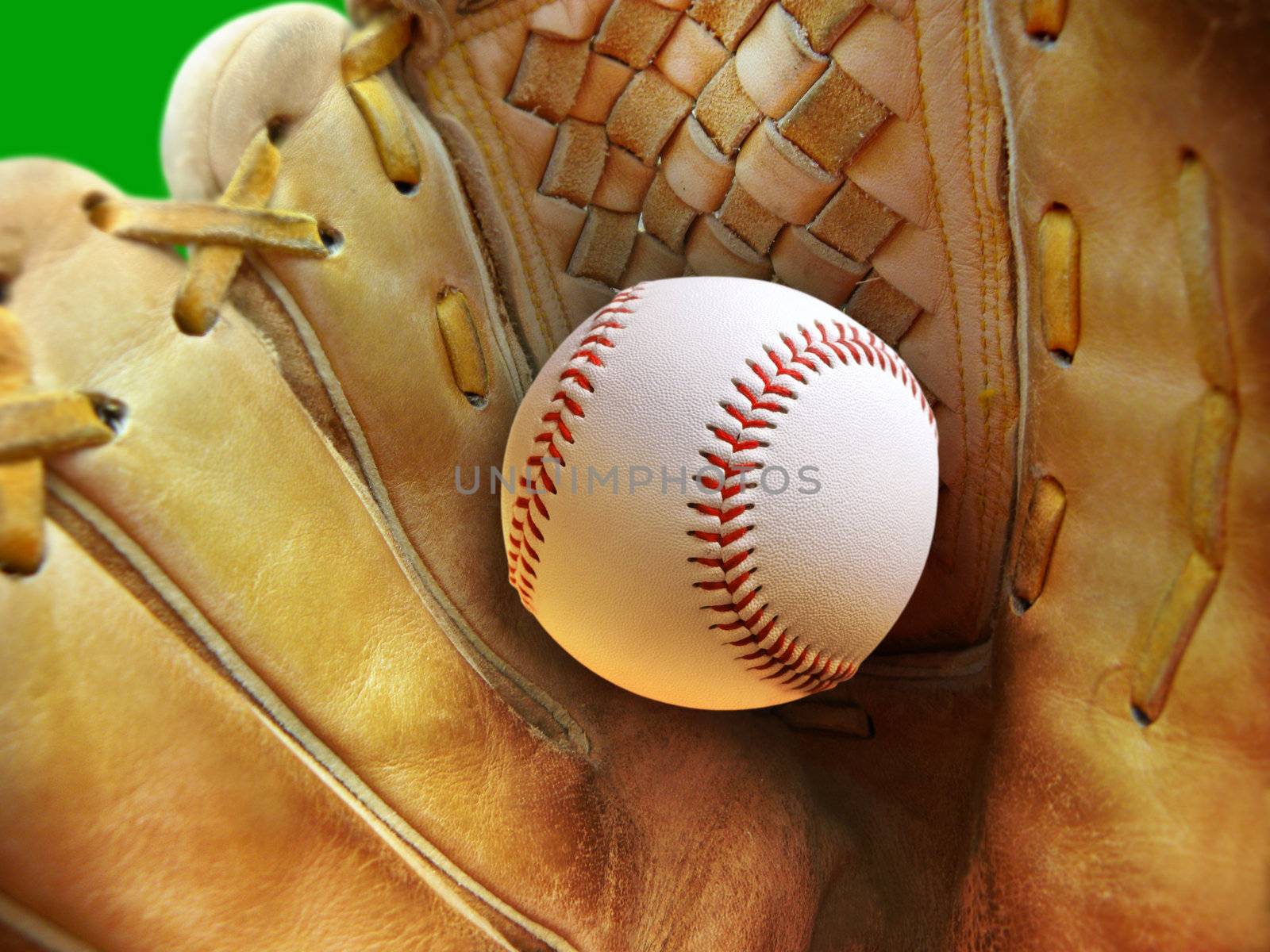 Leather glove with baseball. Close-up with shallow dof. Focus on seams of ball.