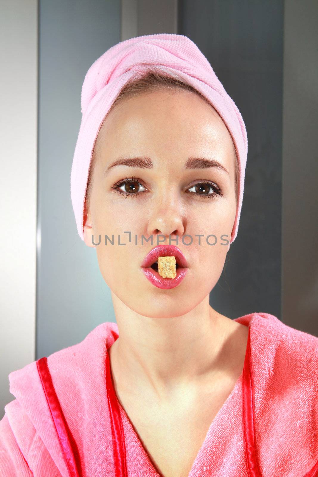 face of beautiful girl with piece of sweets