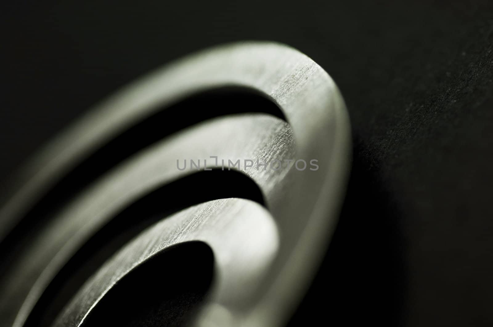 abstract detail of silver metal contemporary jewellry by jackmalipan