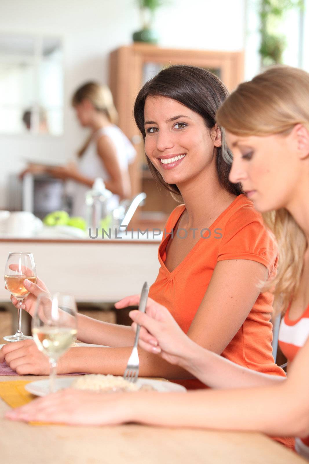 Women having lunch by phovoir