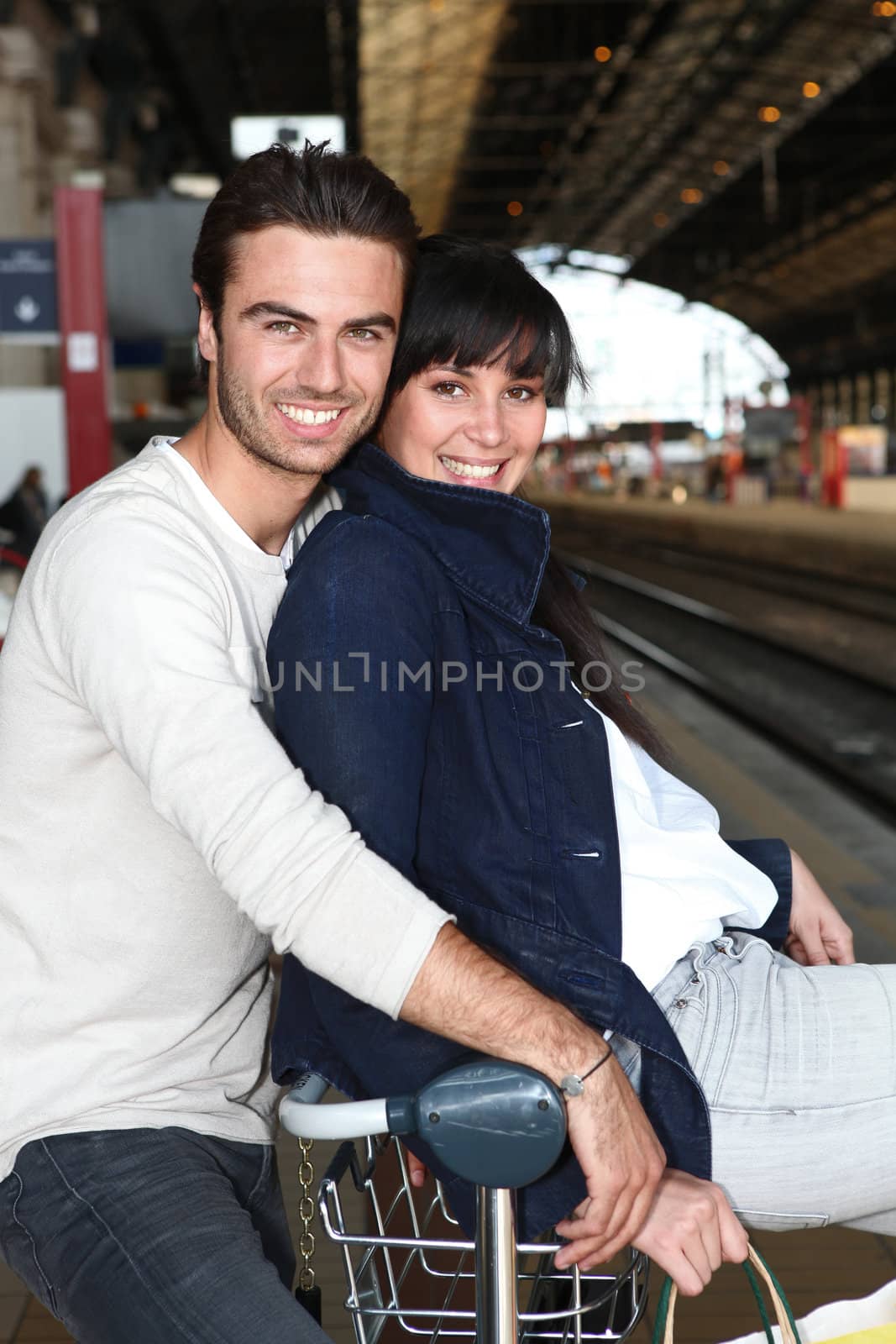 Couple waiting for the train by phovoir