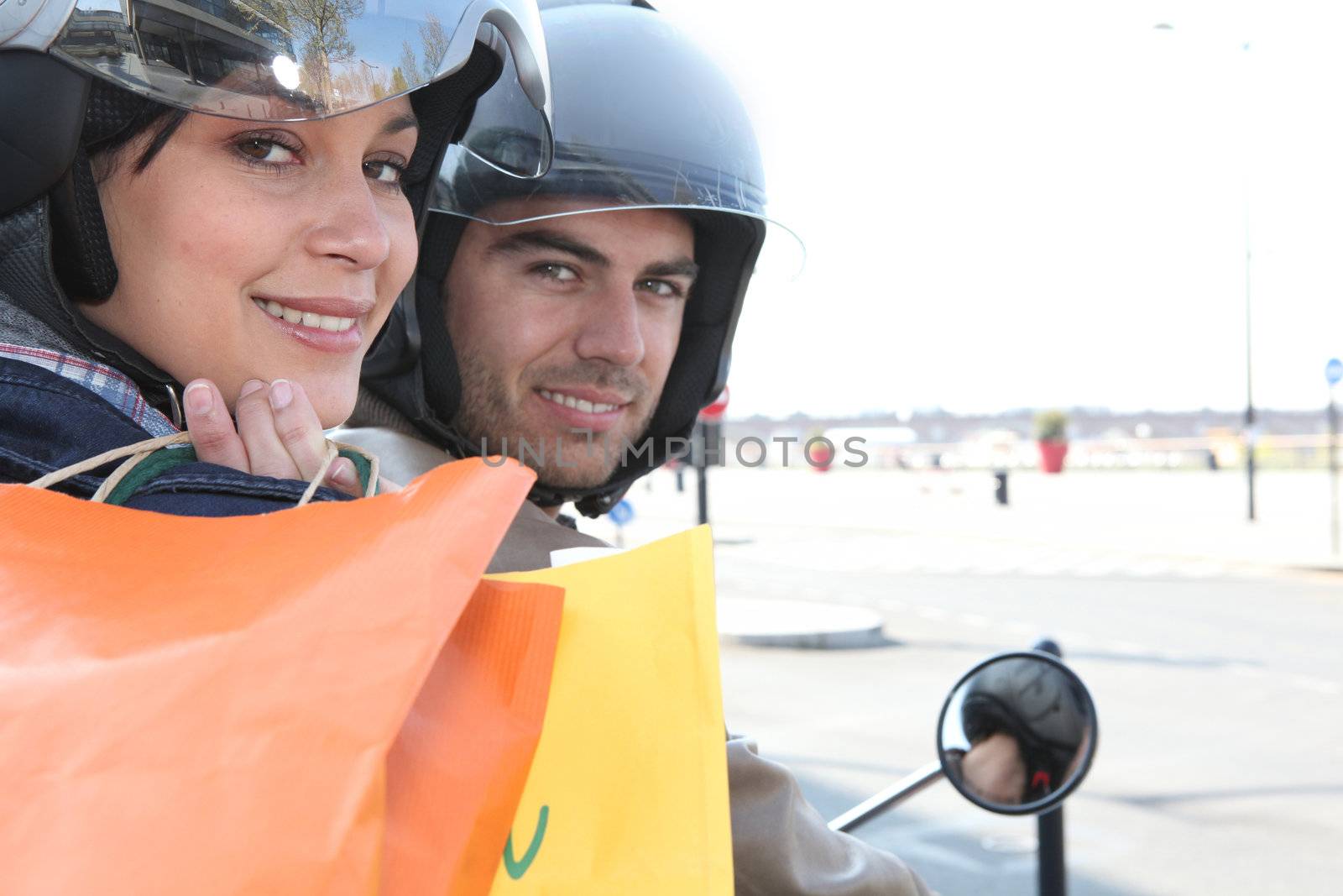 Couple on a motorcycle by phovoir