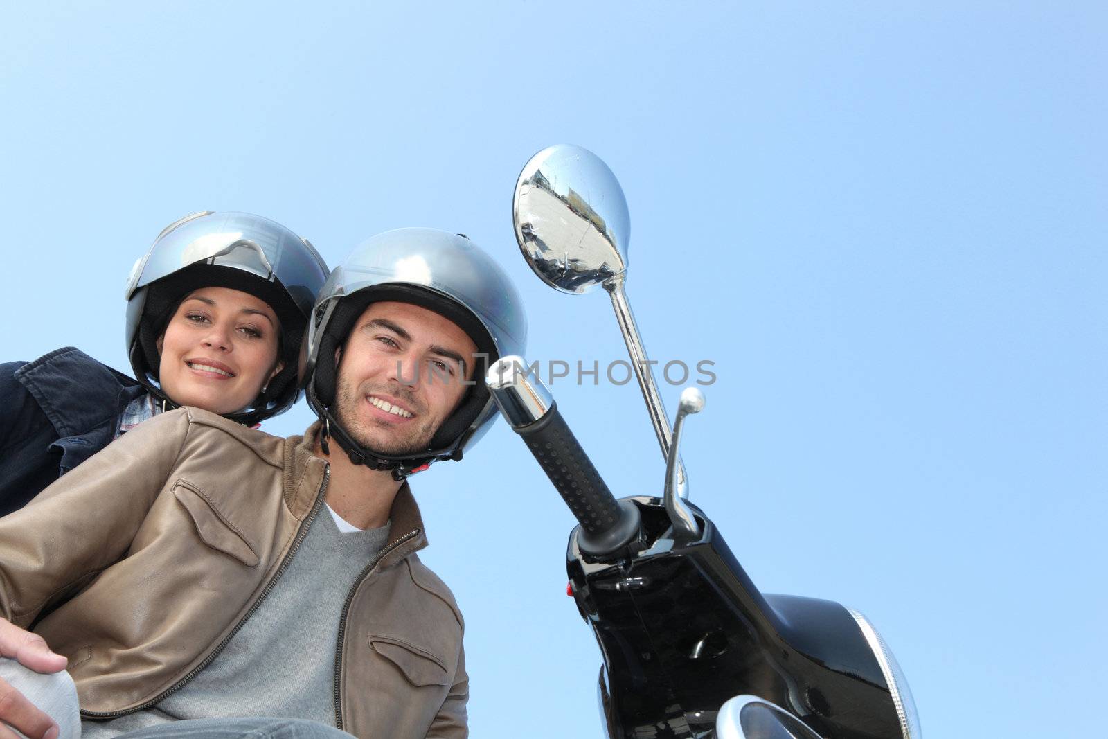 two people on scooter by phovoir