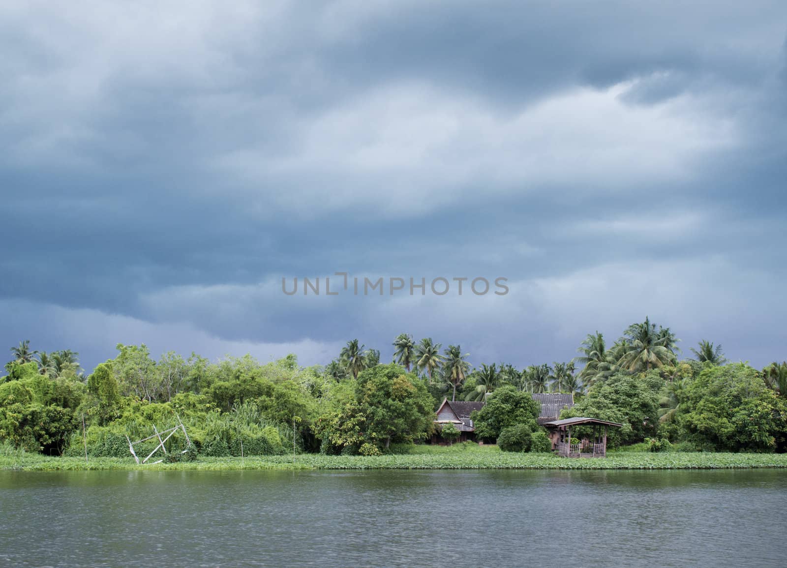 river house during monsoon rainy season in thailand
