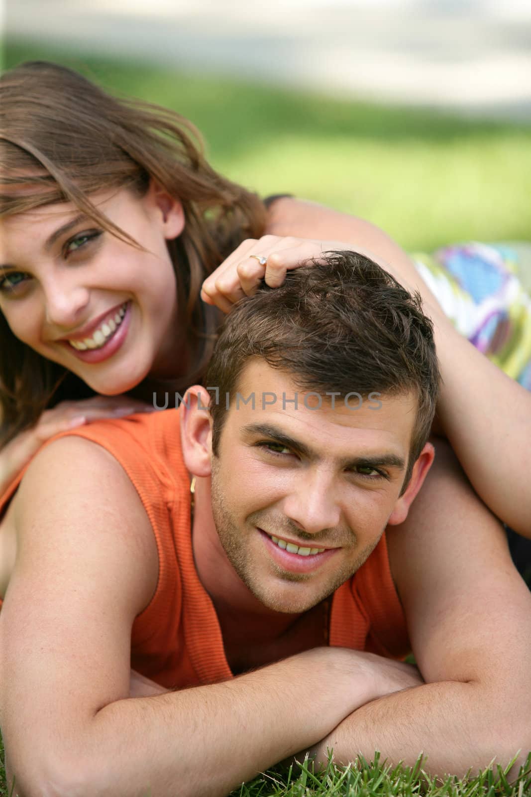 Couple lying on the grass