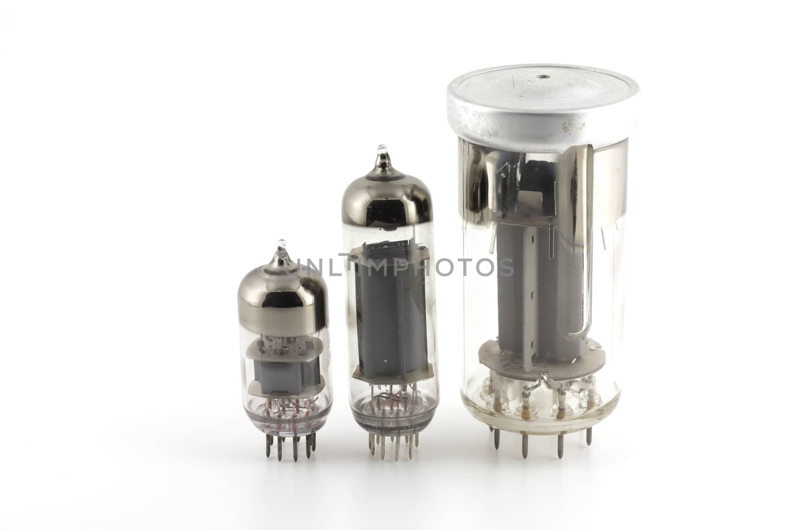 Three old triodes (valves) over white