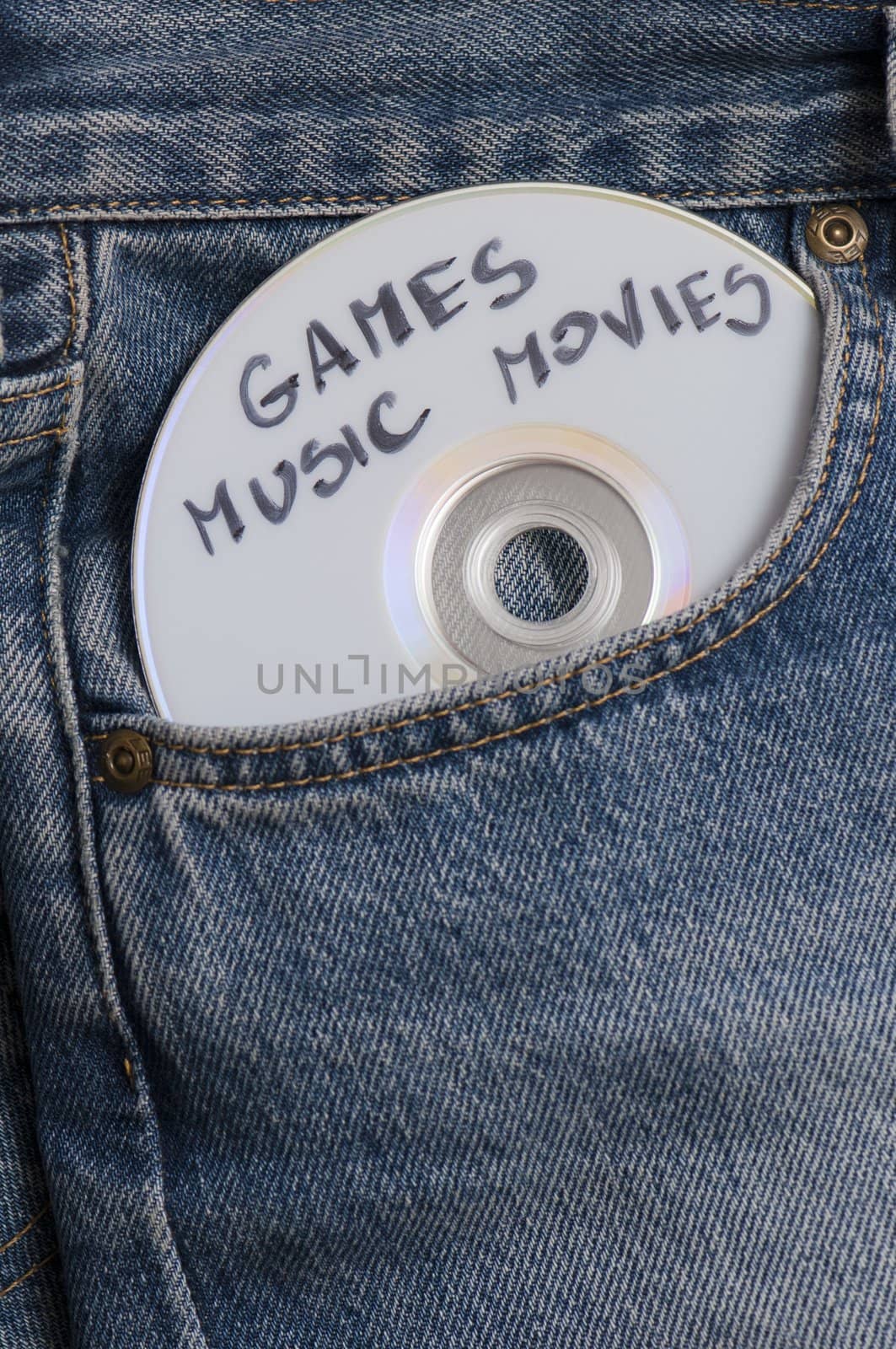 DVD with games, music and movies in pocket of the jeans