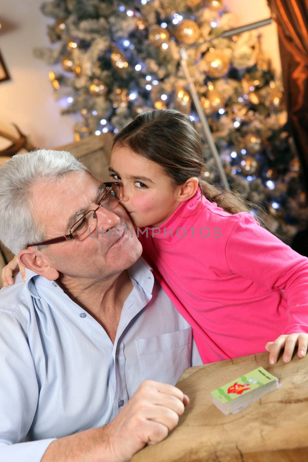 Grandfather and granddaughter at Christmas