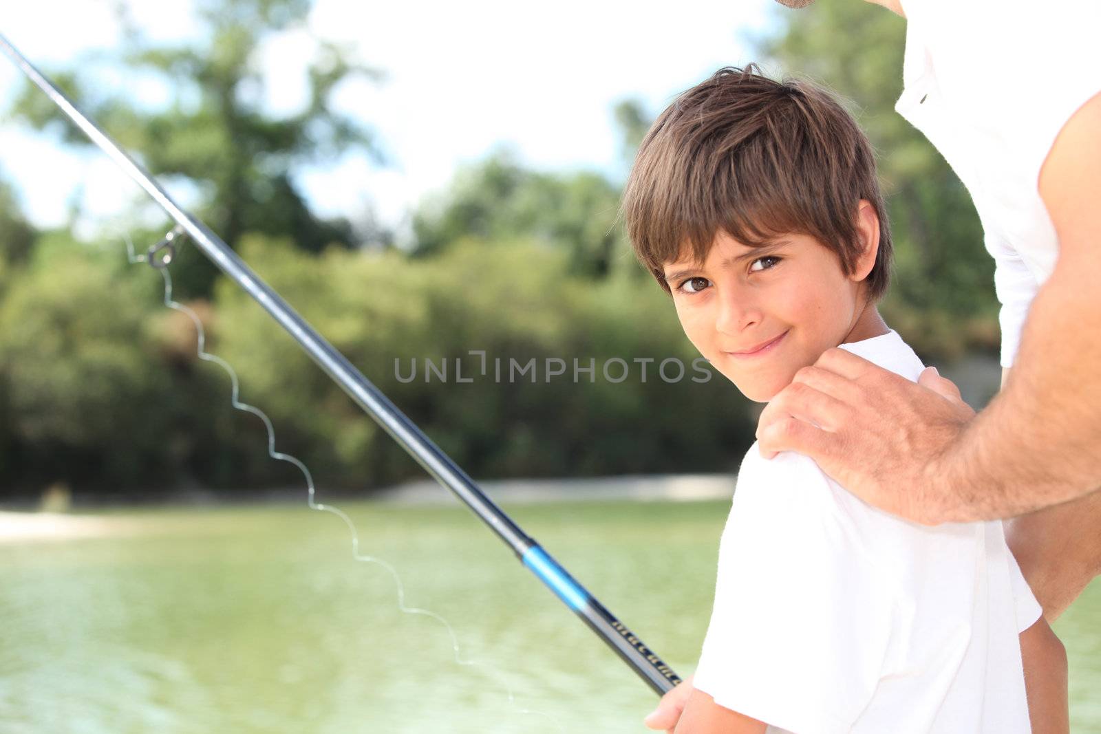 Father and son on fishing trip by phovoir