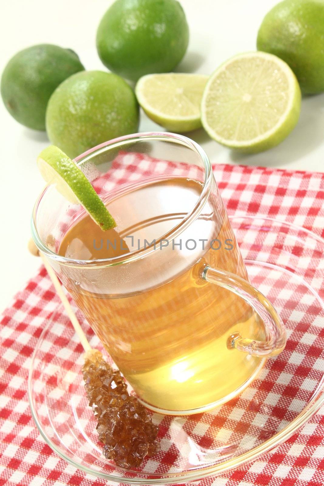 fresh hot lemon tea in a glass with candy