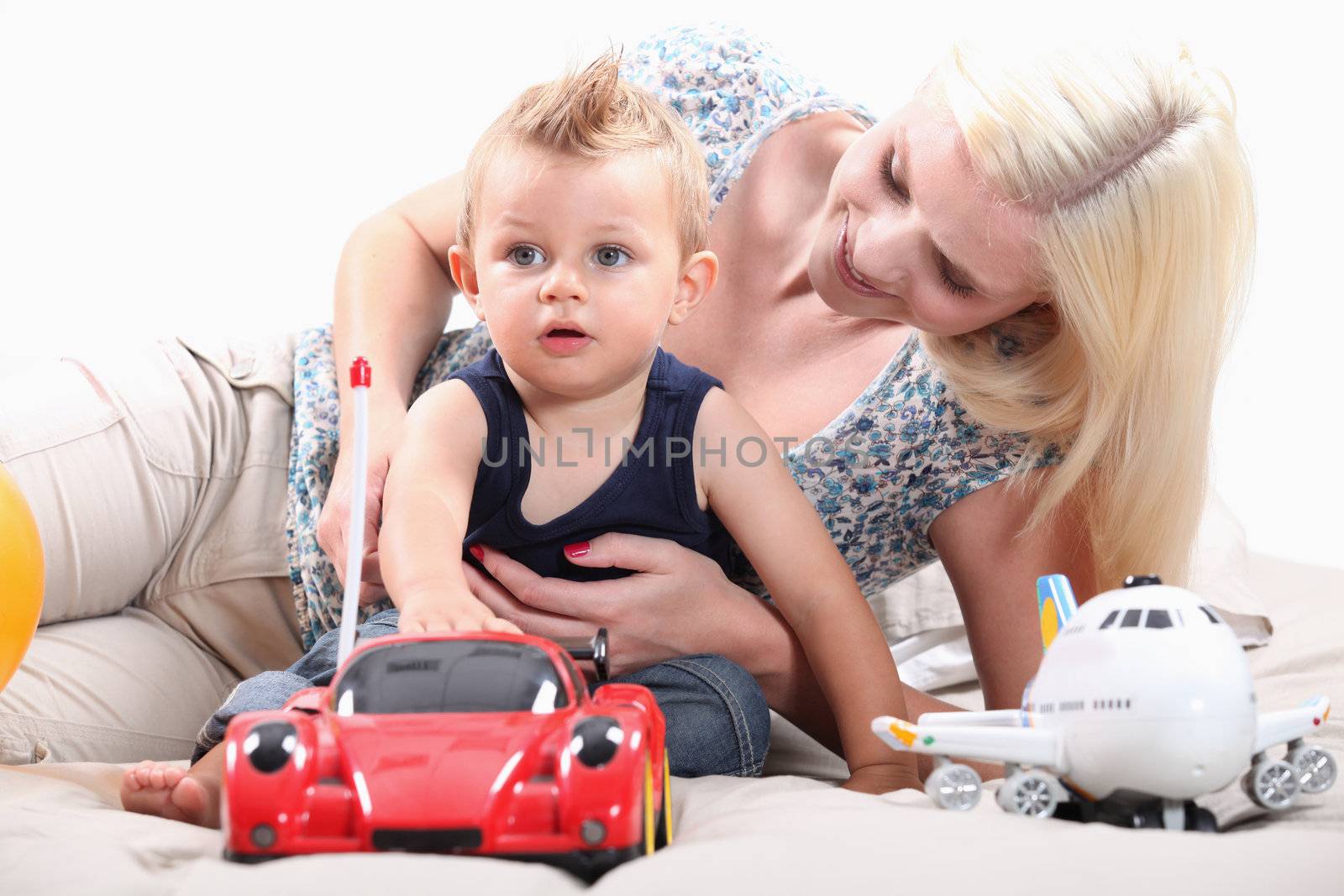 Little boy with radio-controlled car by phovoir