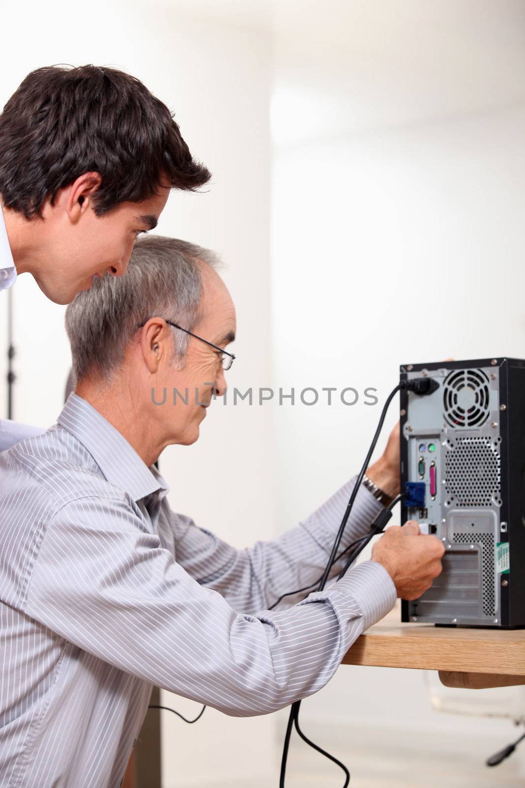 Father and son repairing PC