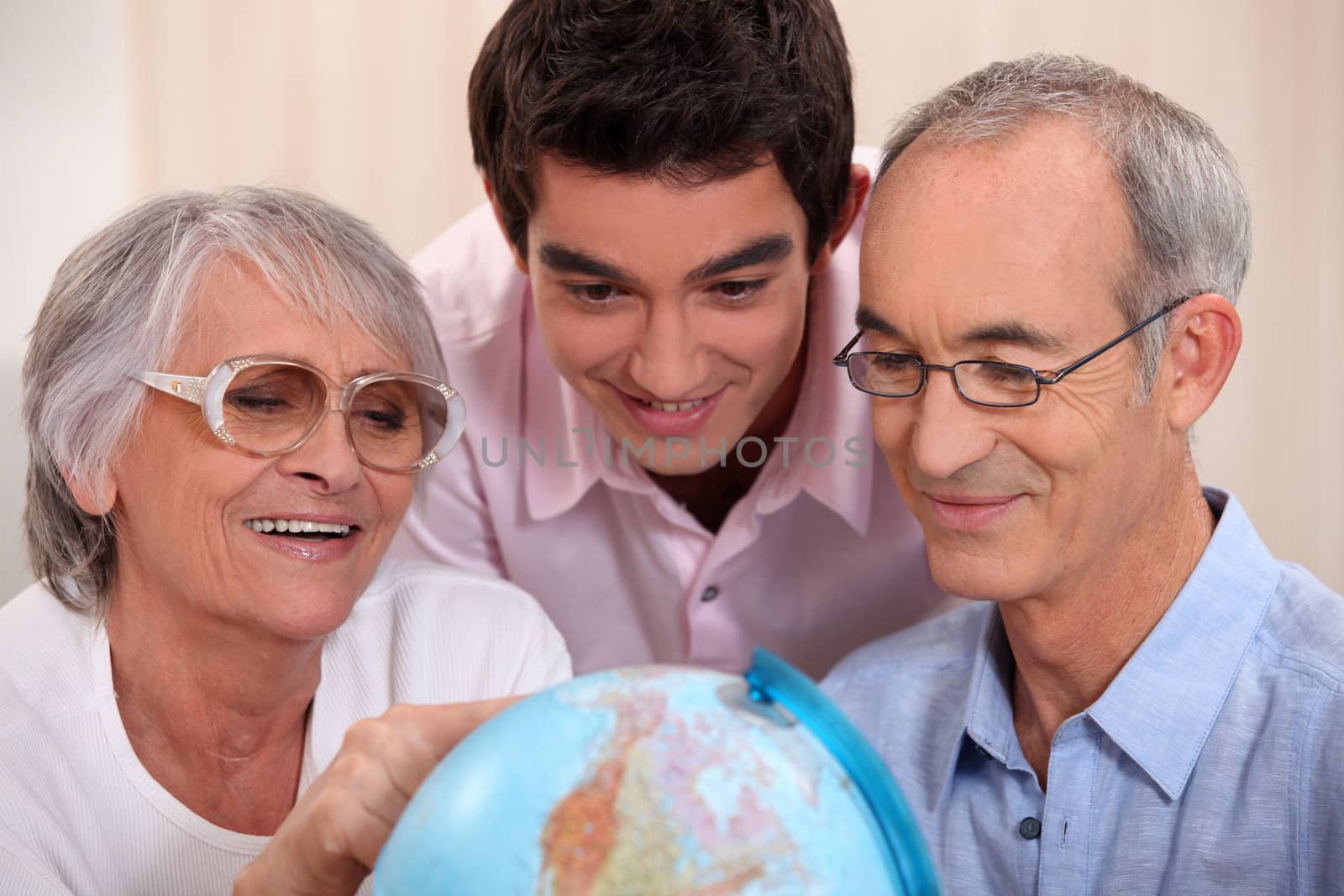 Family gathered around globe