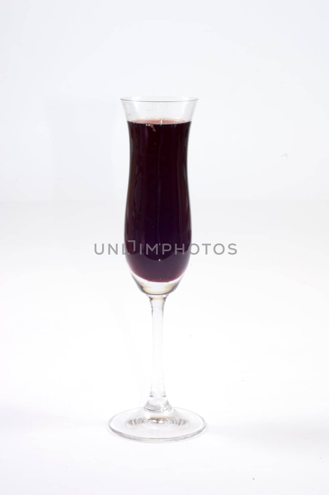 red wine in fine glass on white background