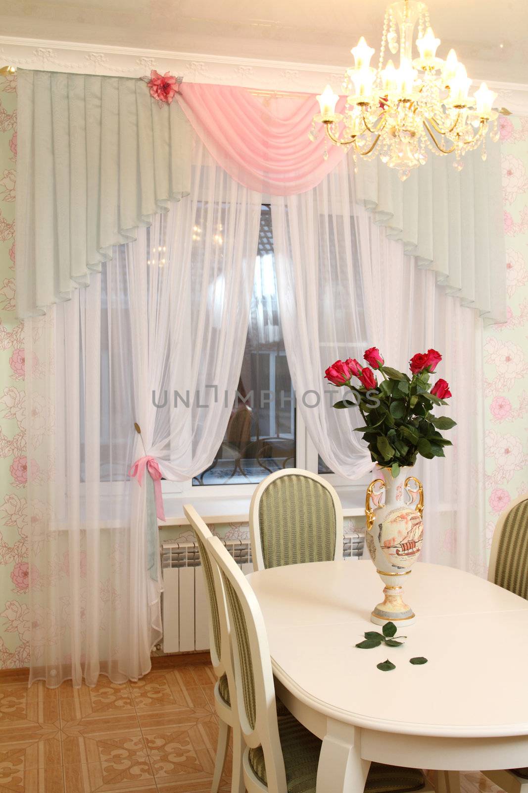 beautiful interior of kitchen with a dining table and a window with a curtain, a vertical shot, a double 2