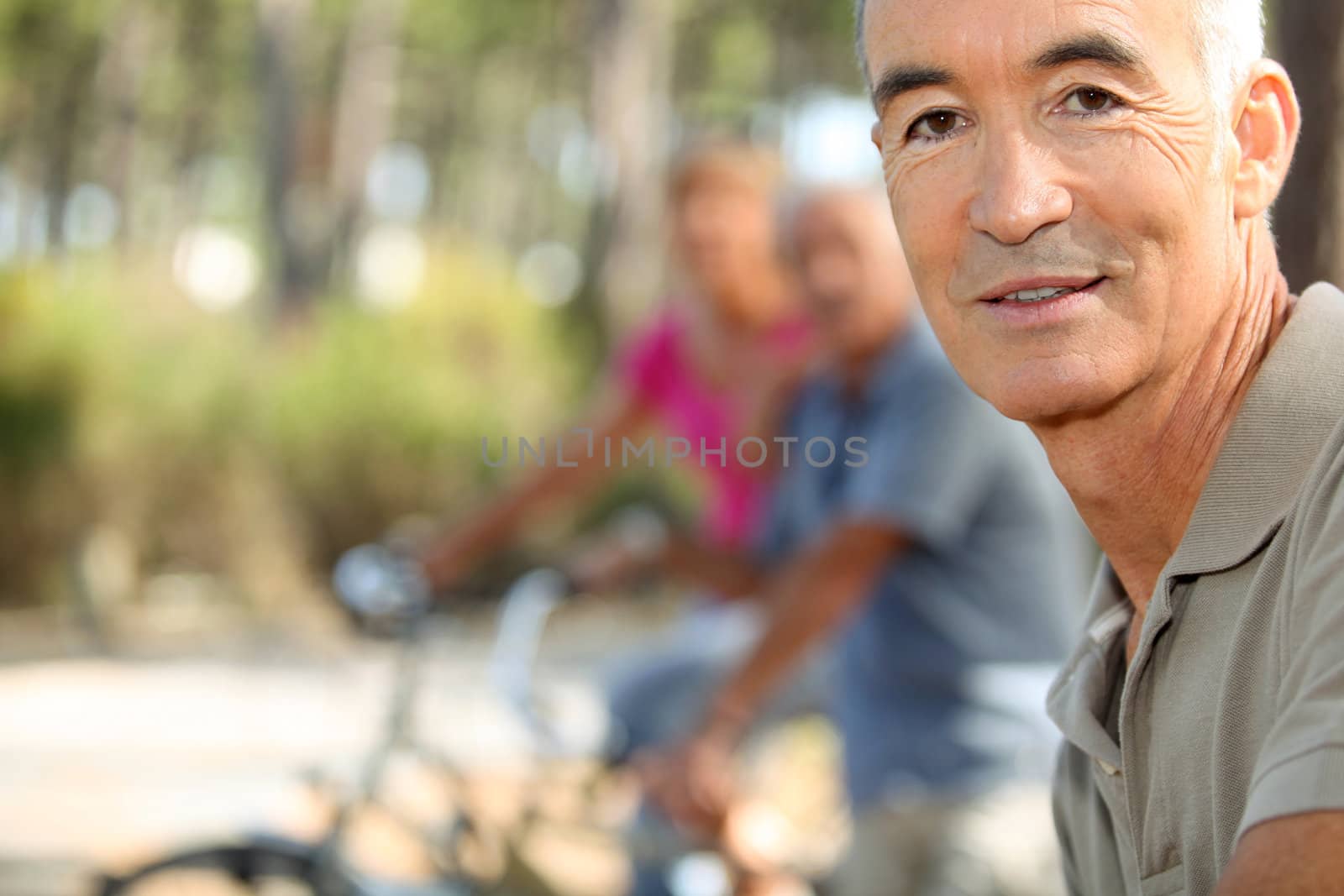 grandfather on bicycle outdoors