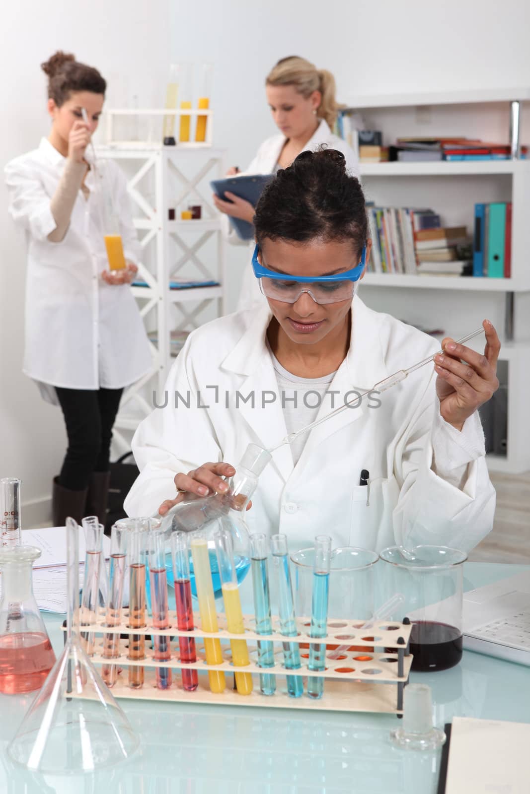 Students in a science lab by phovoir