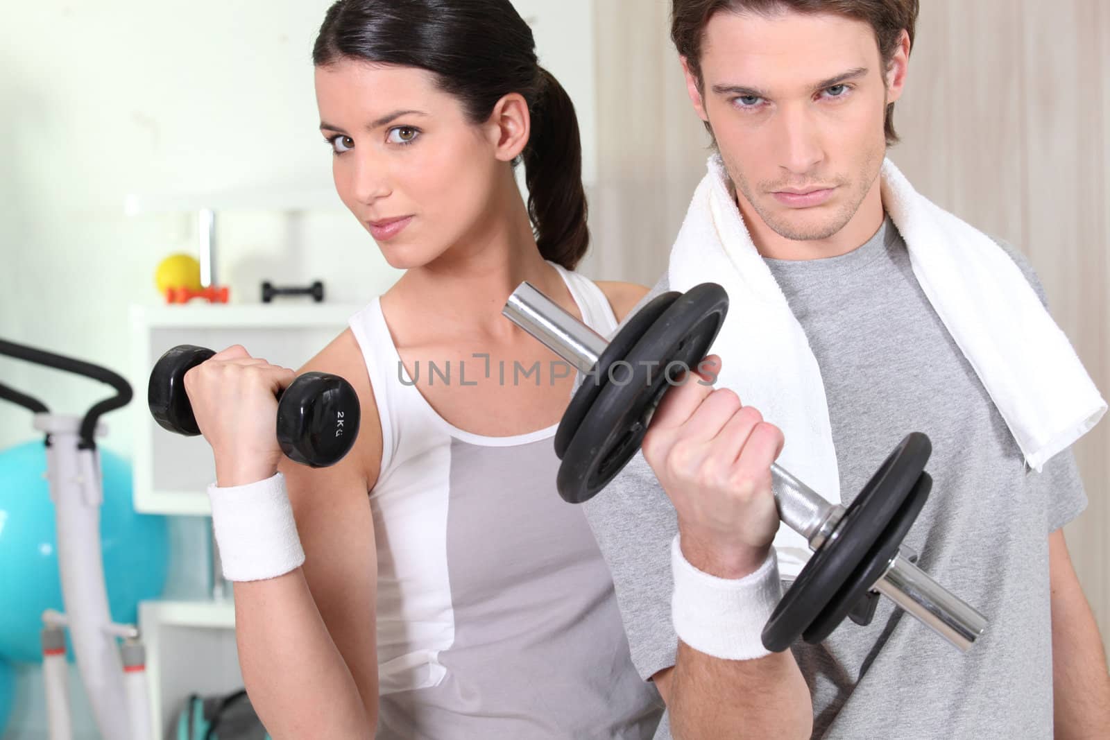 Couple using hand weights