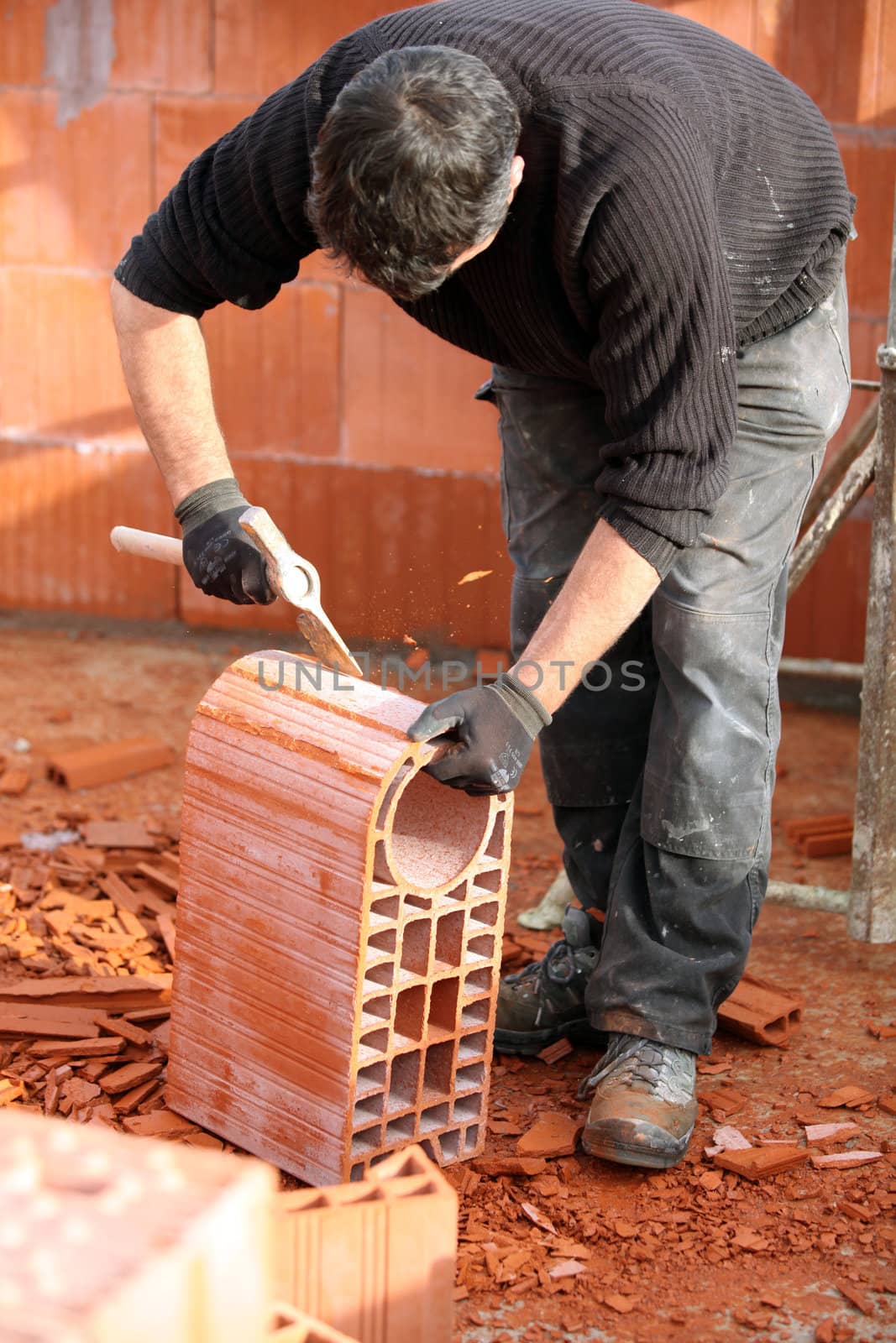 Man shaping a brick