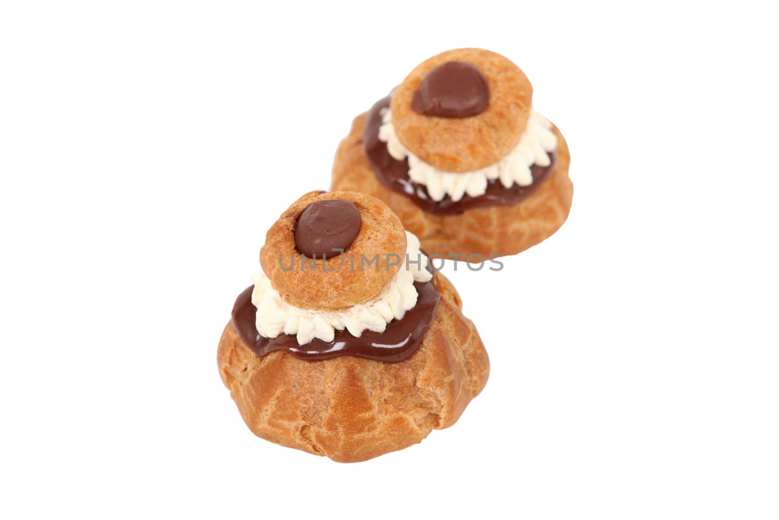 Cream puffs isolated on white background by phovoir