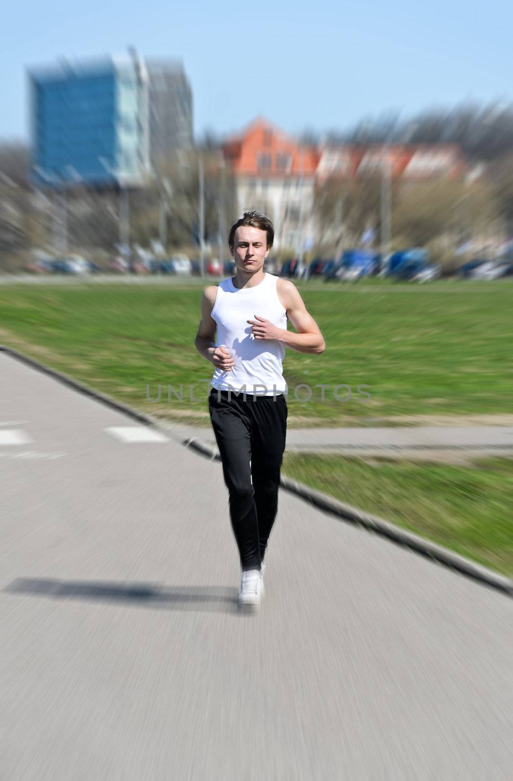 Motion Blur: Athletic young male running 