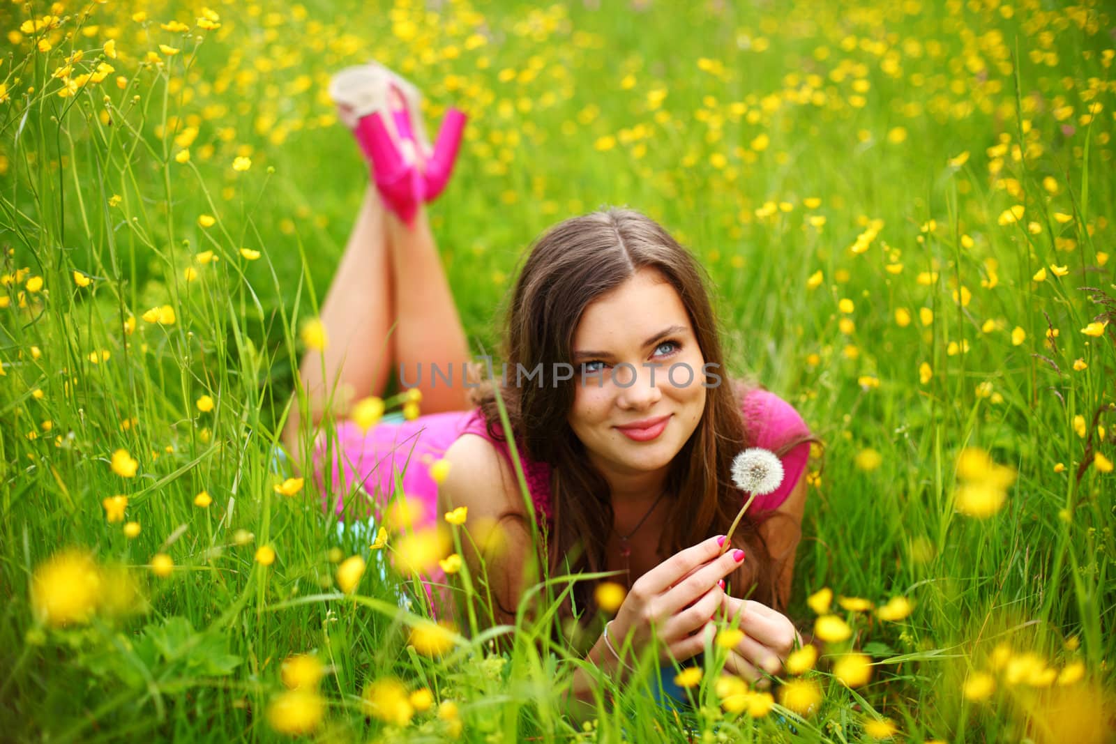 woman blow on dandelion by Yellowj