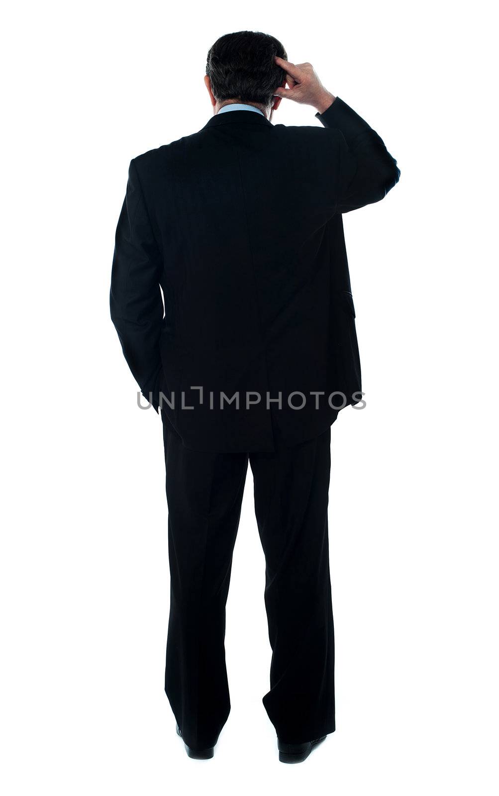 Rear view of corporate person thinking by stockyimages