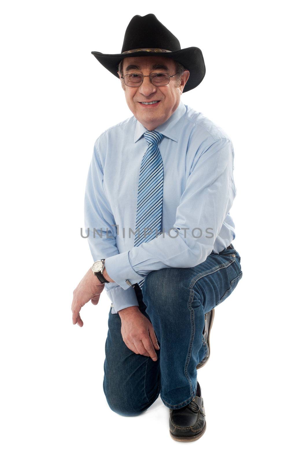 Smiling man wearing cowboy hat on white background