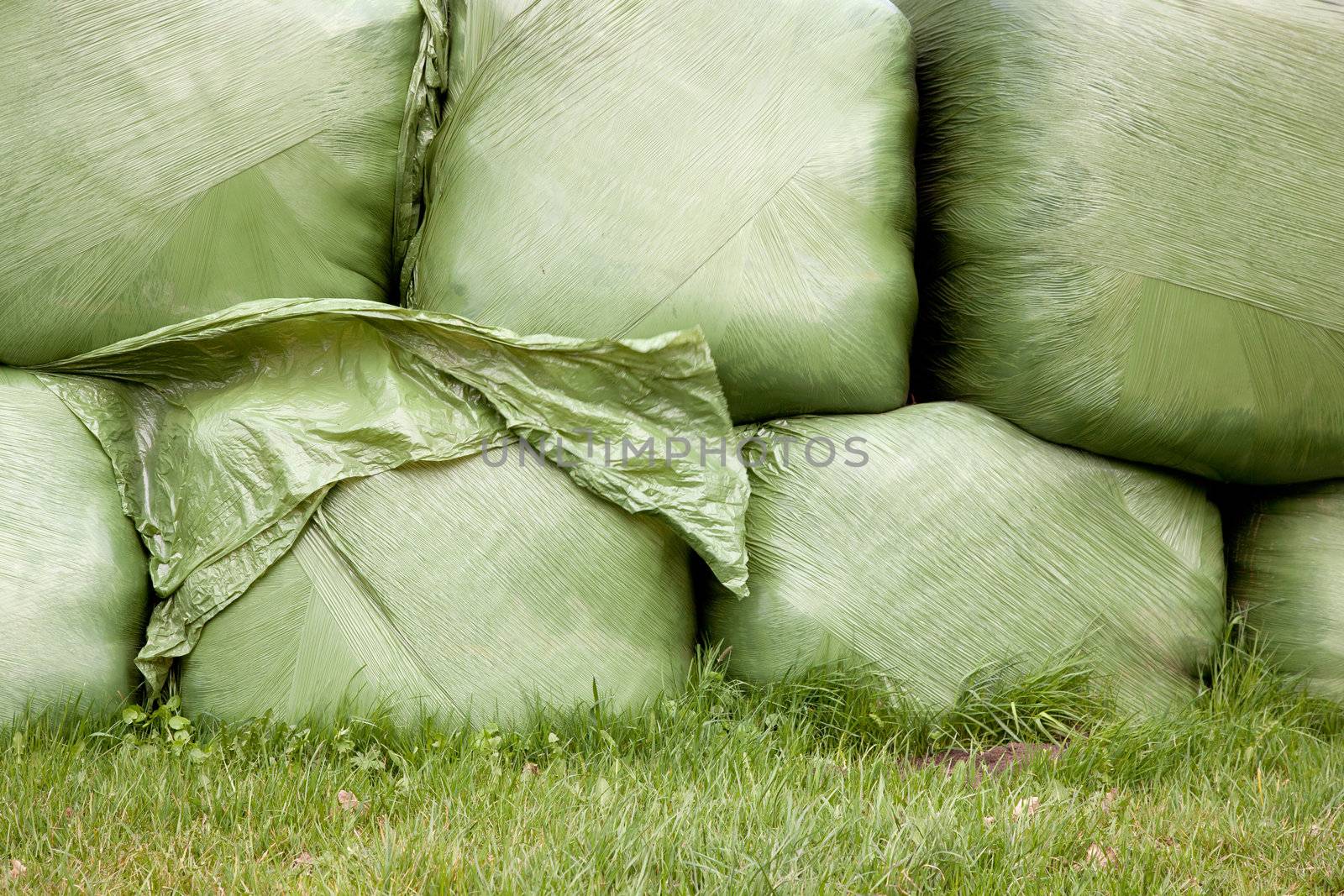 stack of grass wrapped in plastic