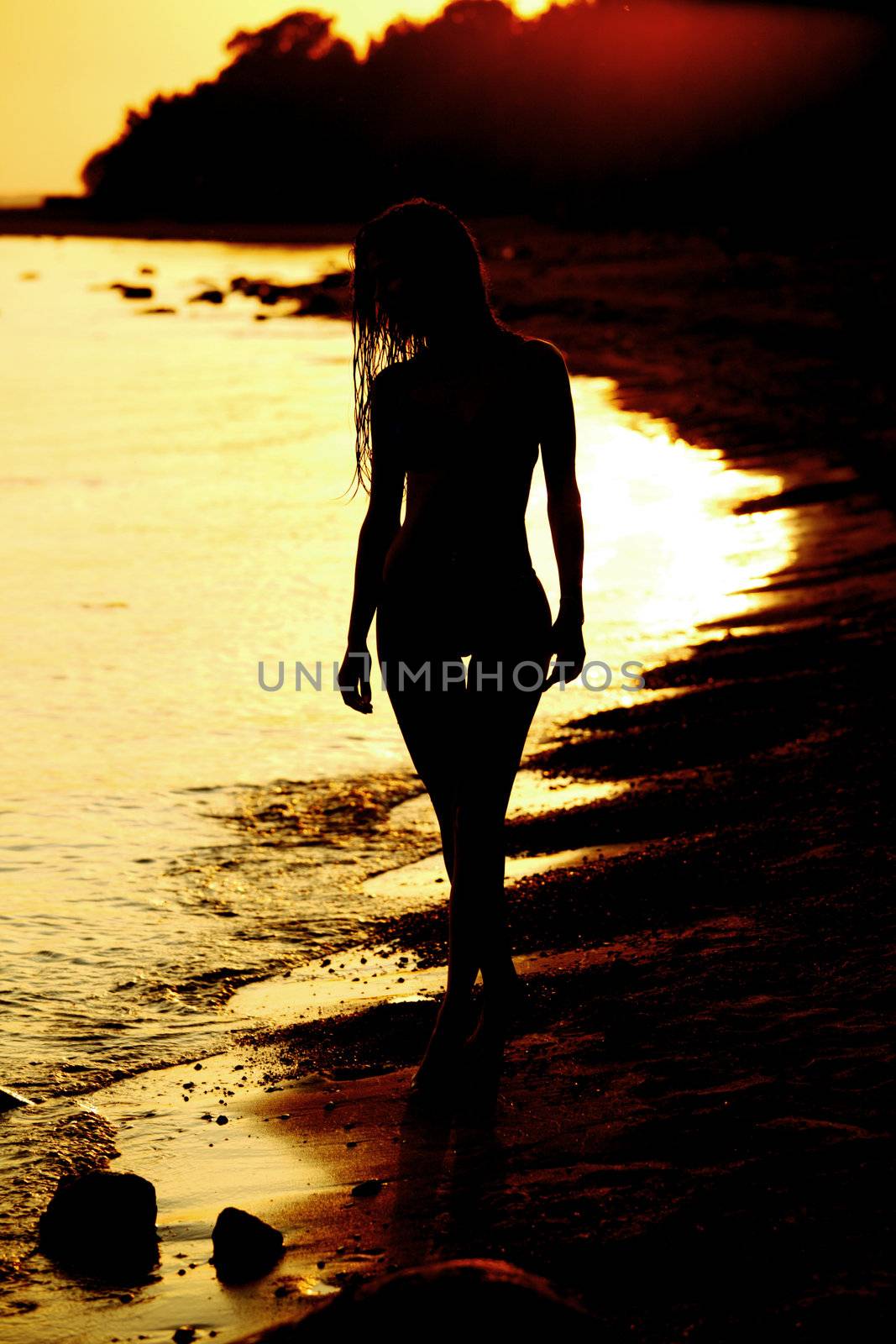 ocean woman in sunrise light