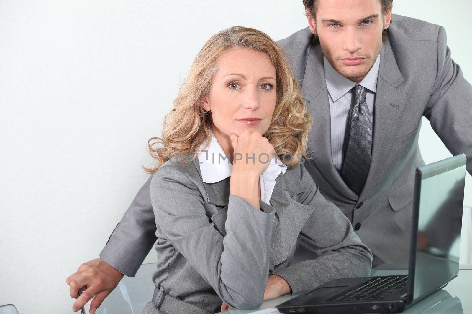 Executives with laptop computer