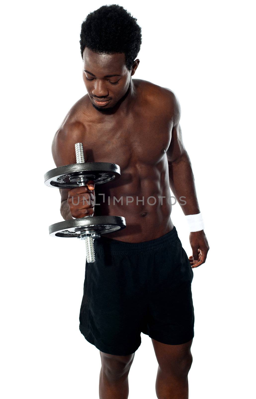 Young man doing biceps excercise by stockyimages