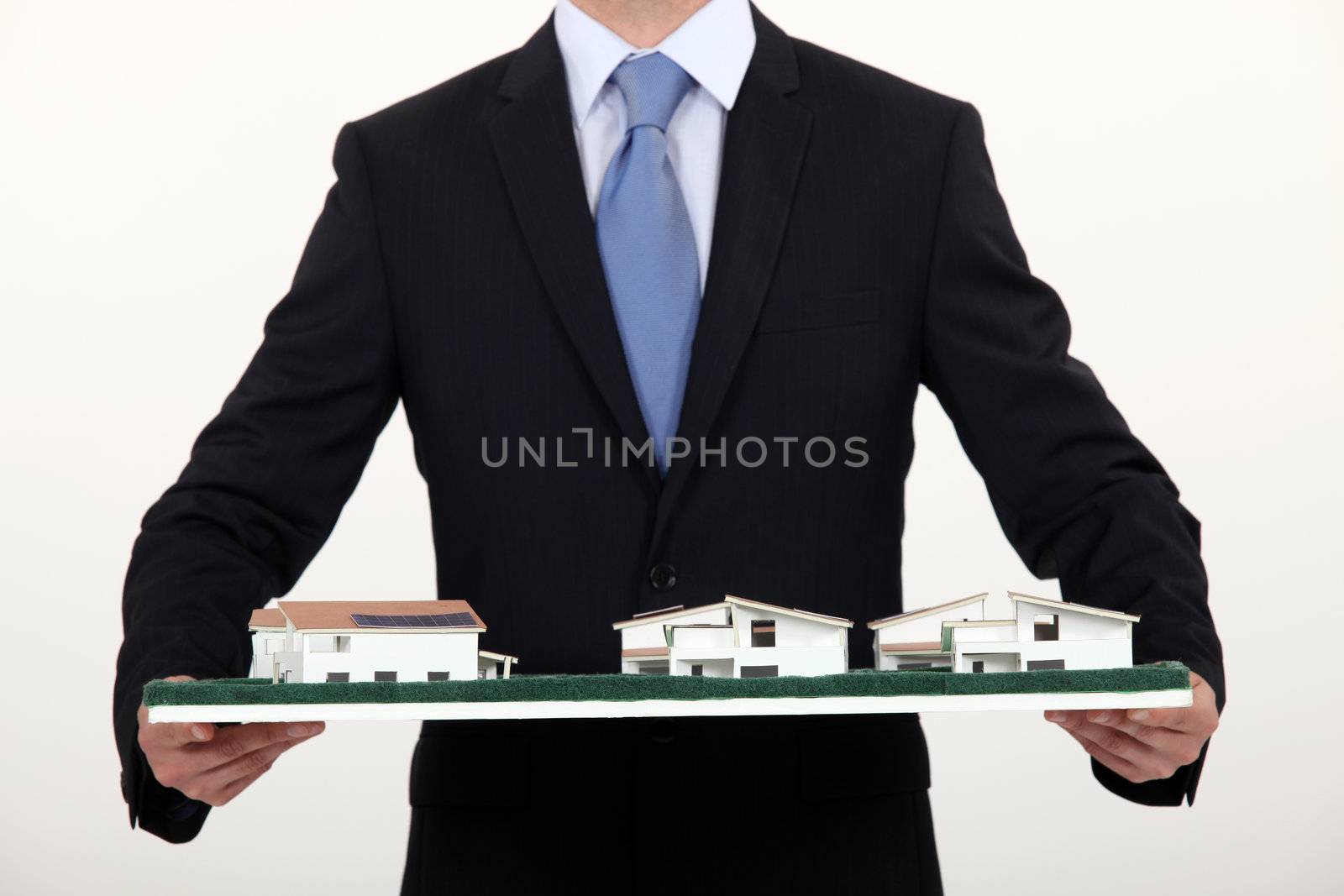 Architect with model housing