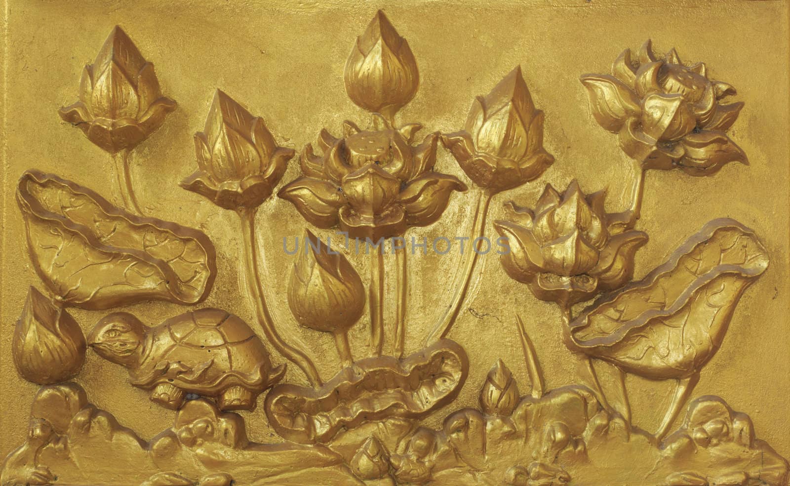 Carving on the wall at Wat Paknam Joelo in Chachoengsao province at thailand.