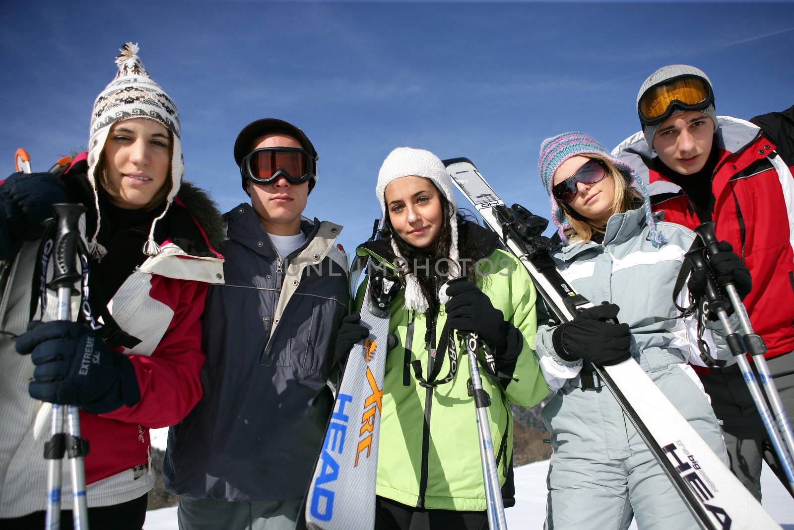 Group of teenagers on a ski trip by phovoir