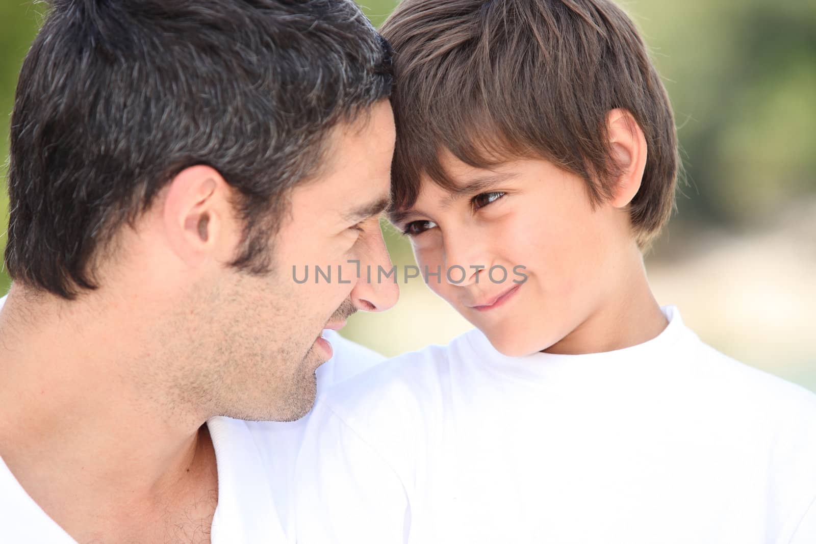 a father and his son looking each other in the eyes