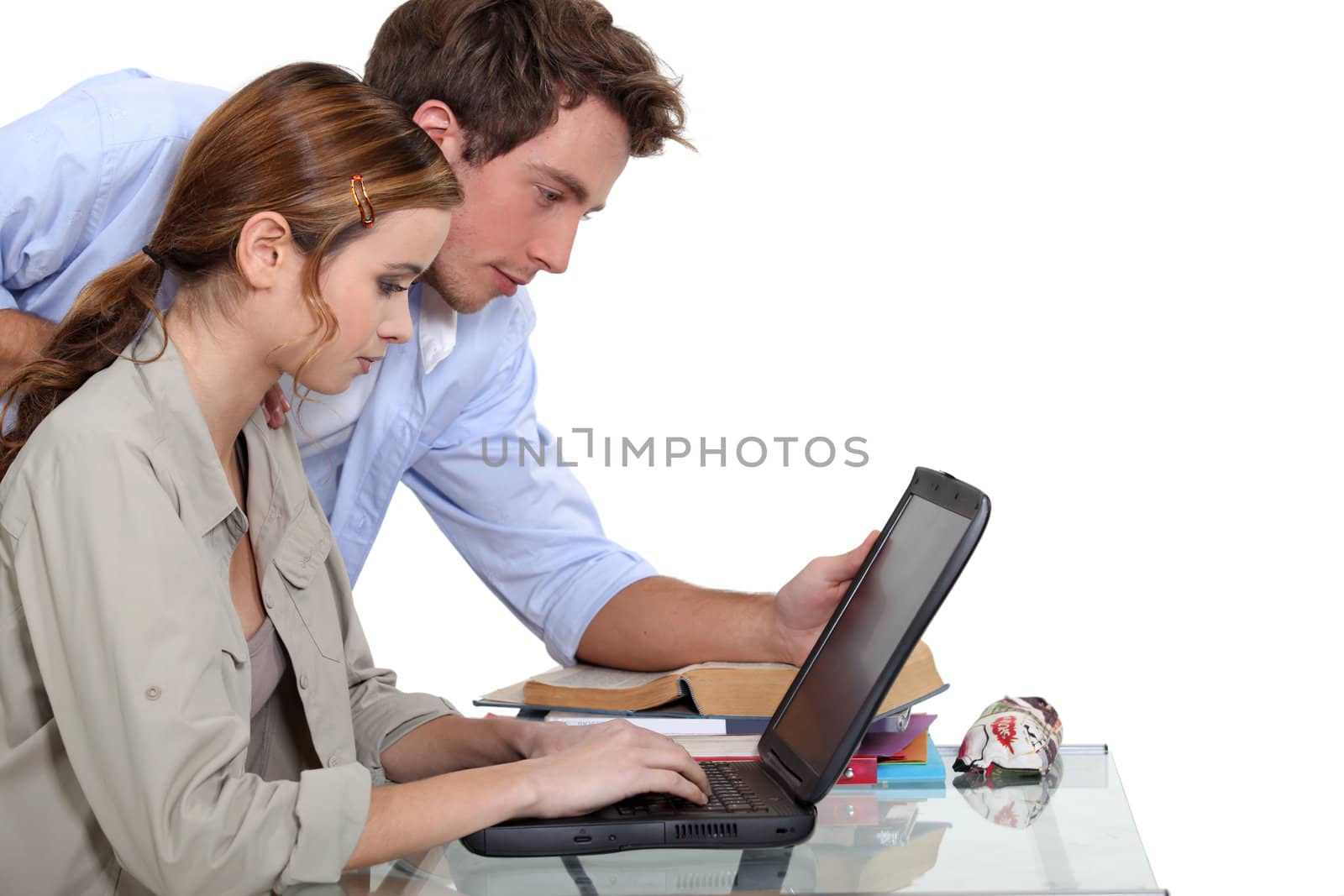 A couple of student over their laptop.