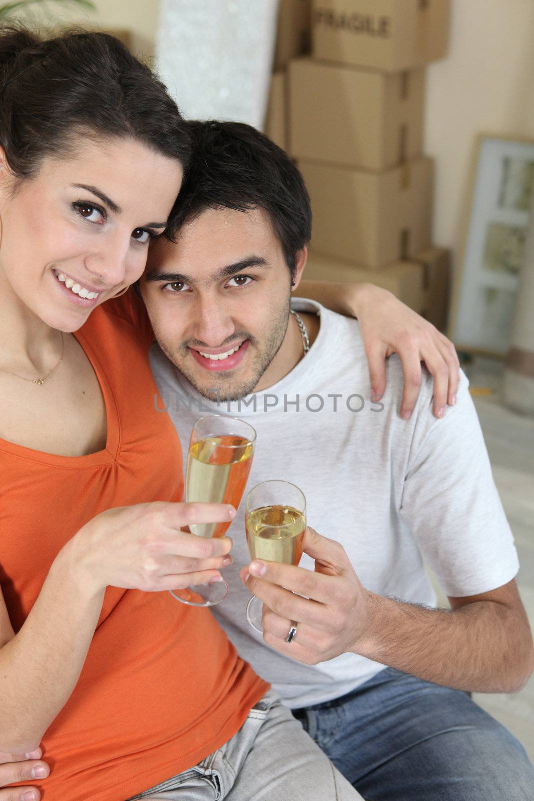 couple celebrating their new apartment by phovoir