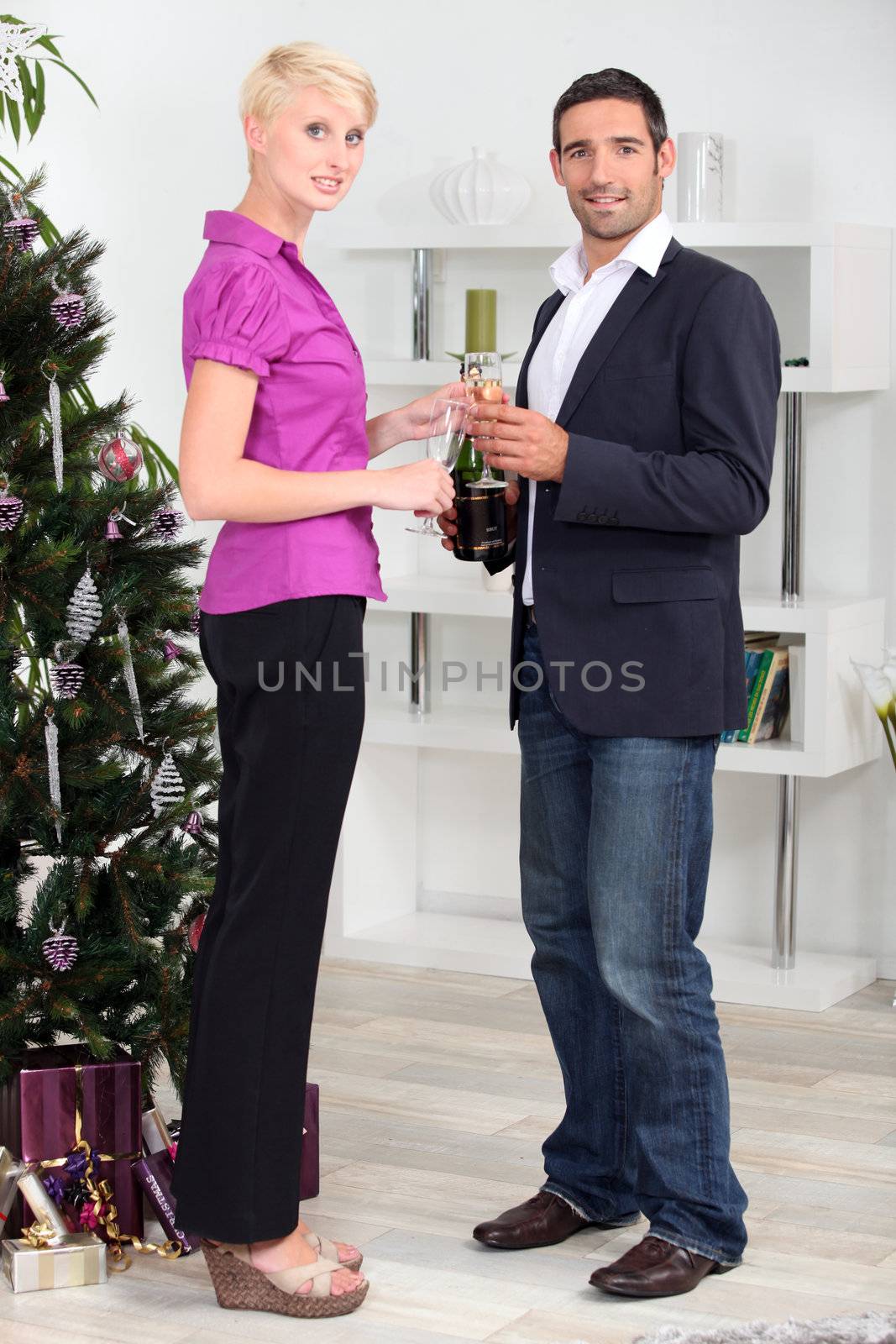 Couple celebrating New Year's Day by phovoir
