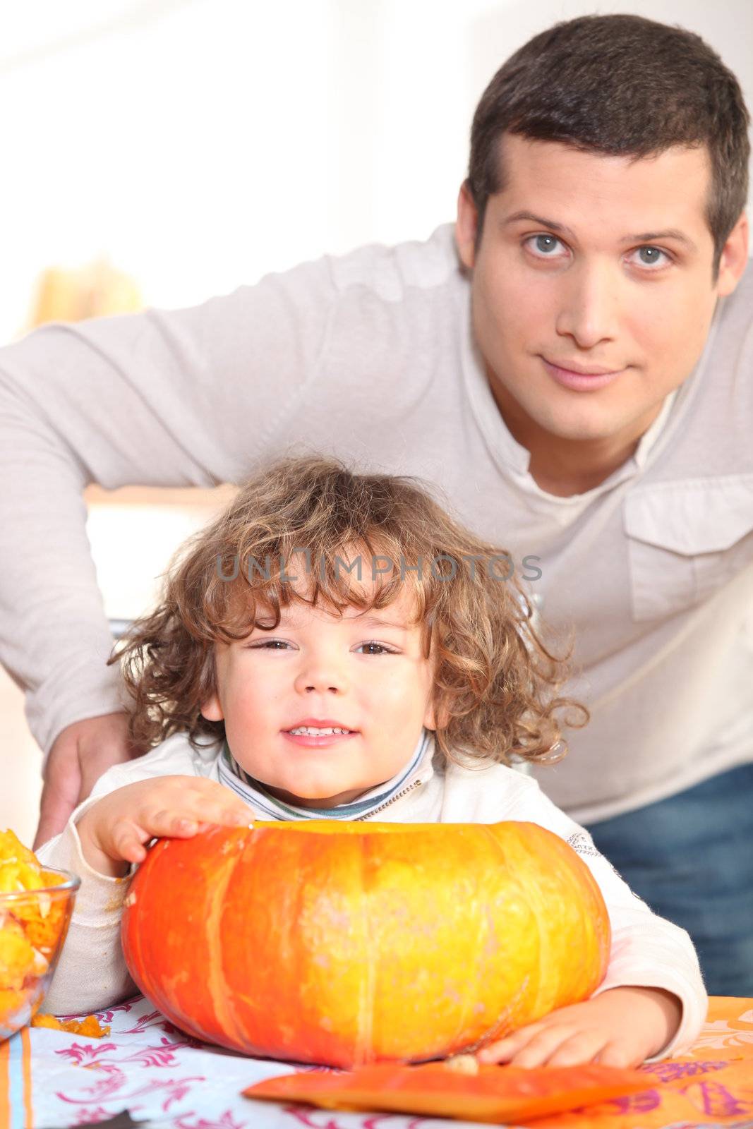 young man, kid and pumpkin