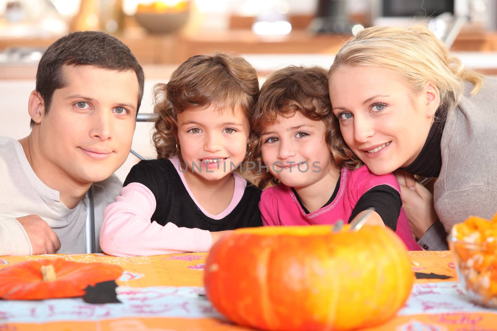 Family carving pumpkins by phovoir