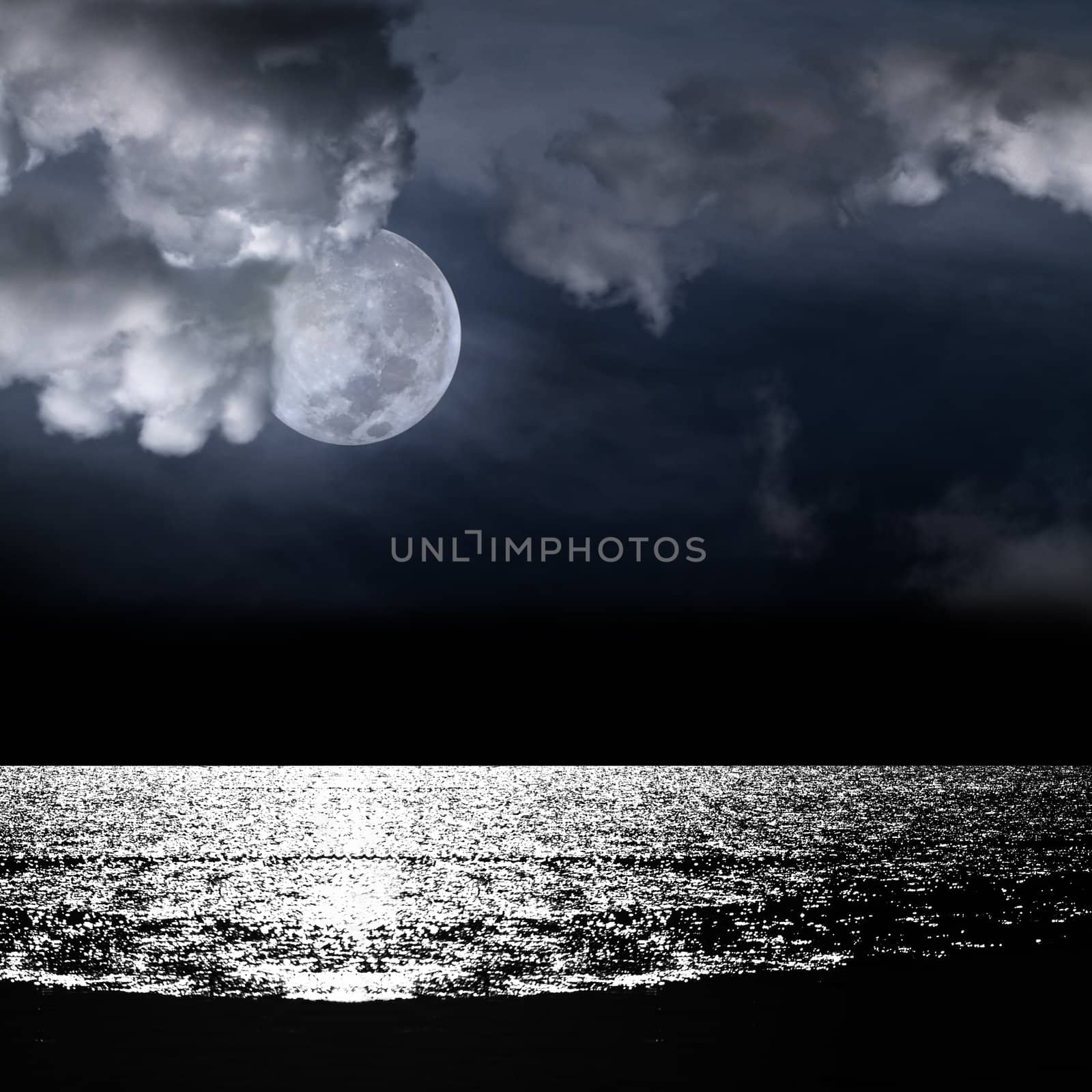 Beautiful full moon behind fantasy cloudy sky over water with reflection