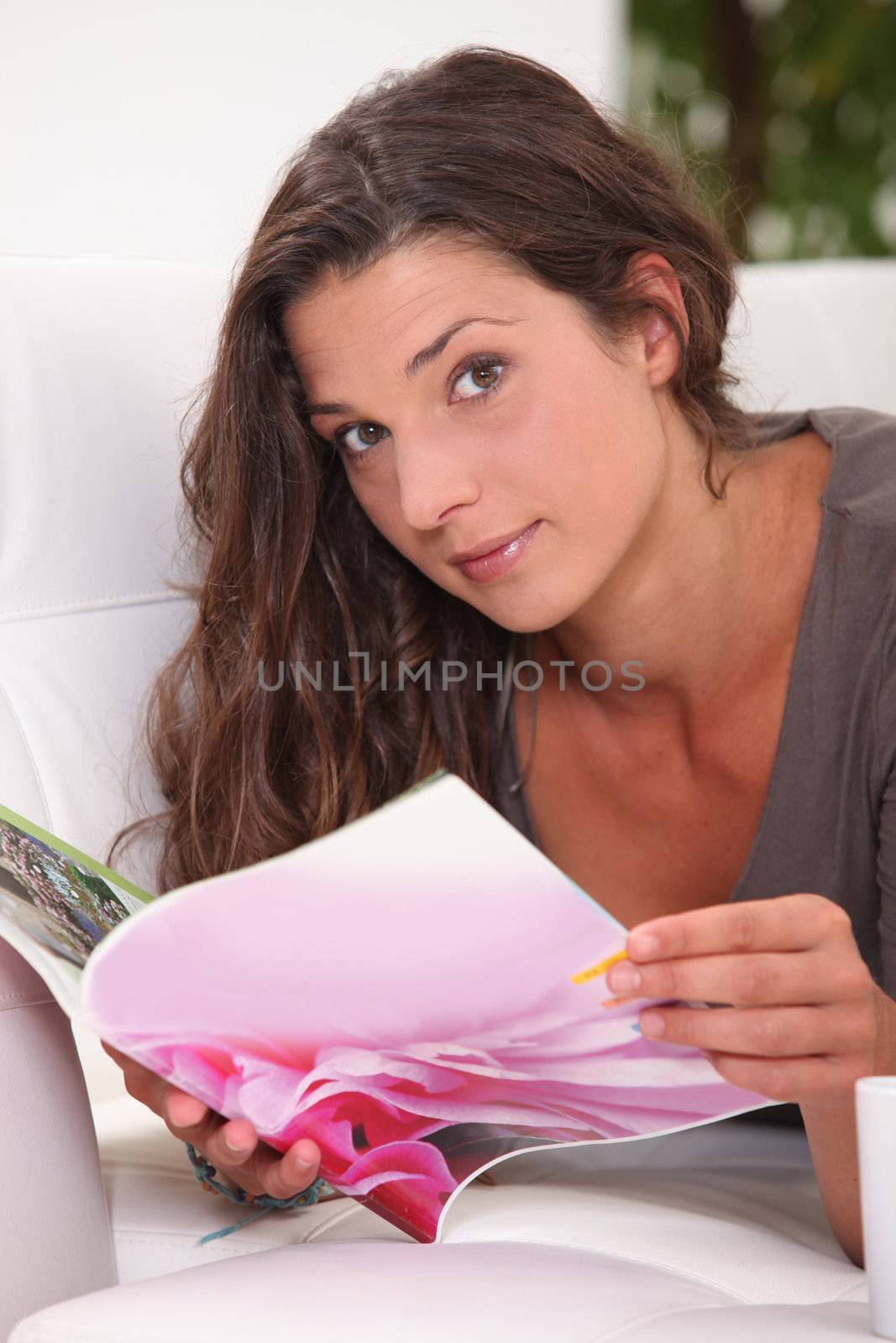 brown-haired woman looking at photos by phovoir